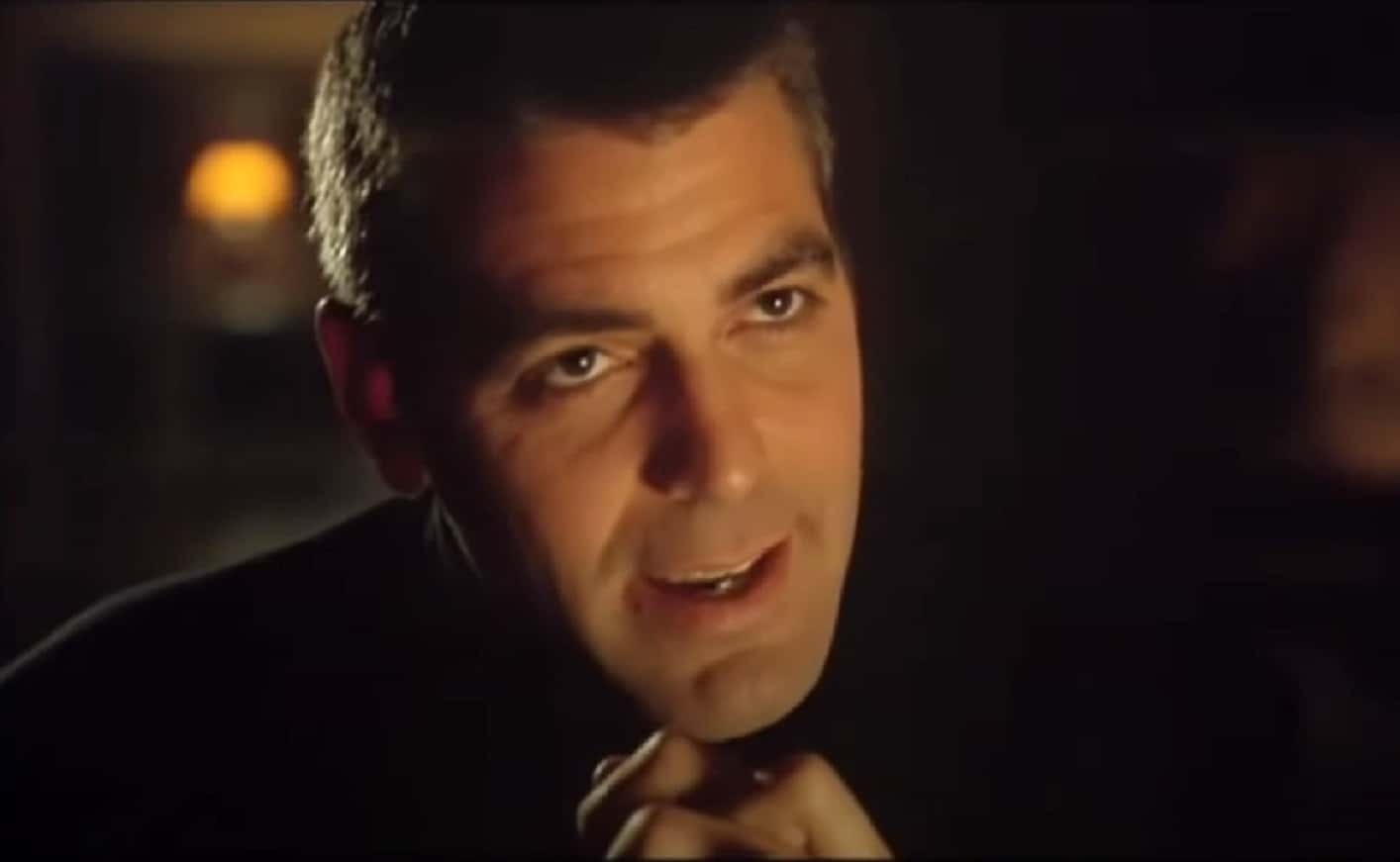 Screenshot of George Clooney talking aand looking at side - from  Batman & Robin (1997)