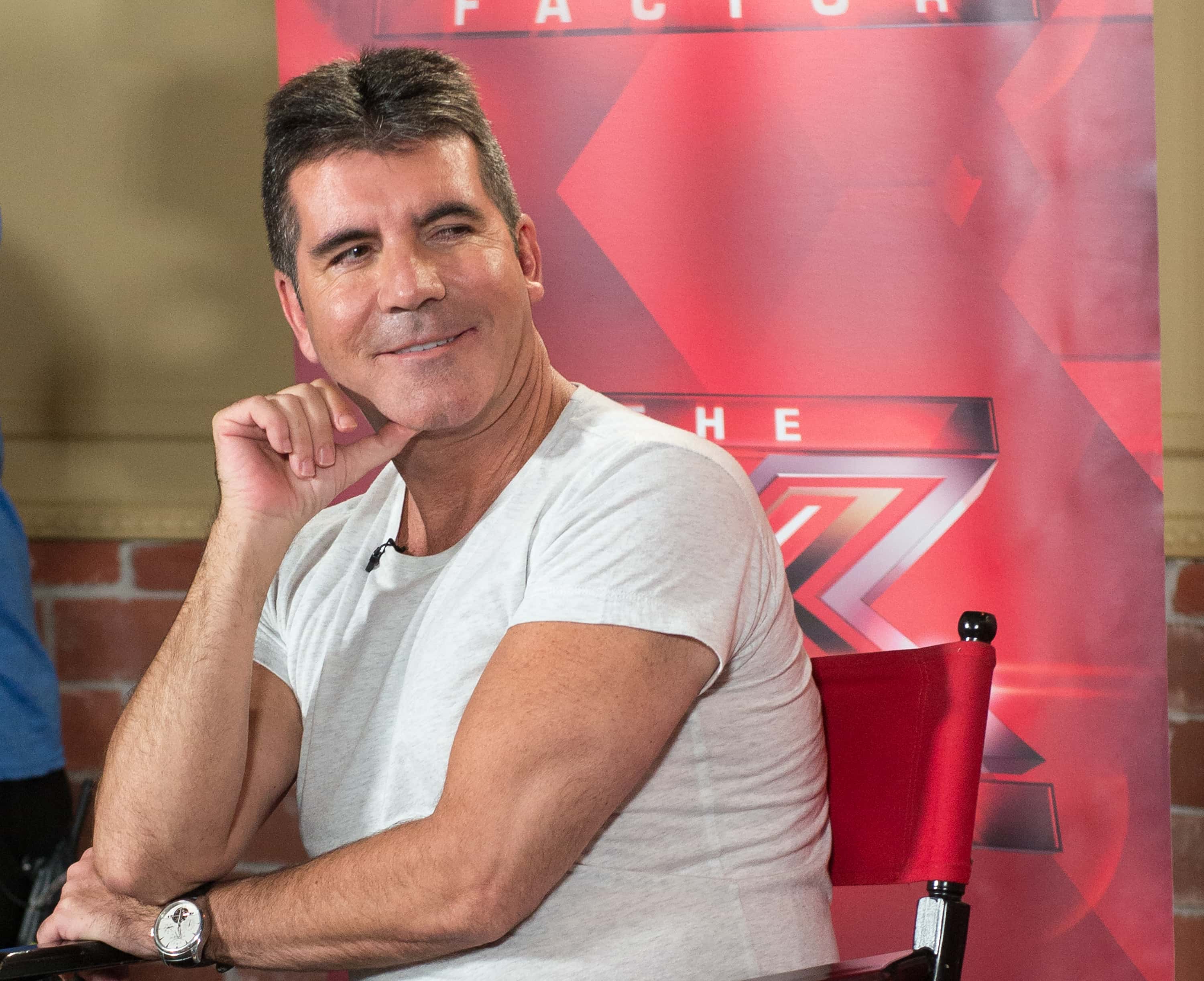Simon Cowell in gray t-shirt 