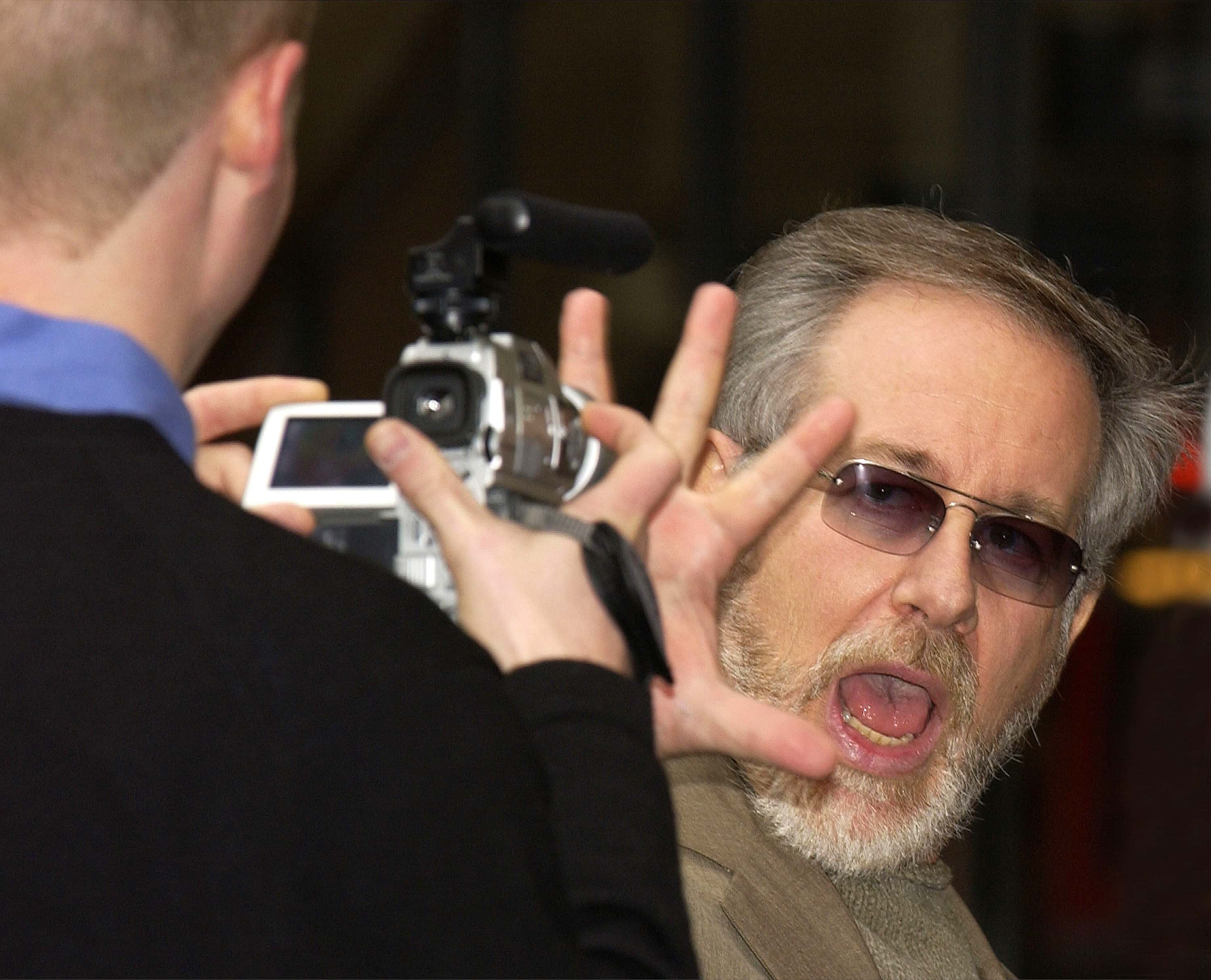 Steven Spielberg with hand up