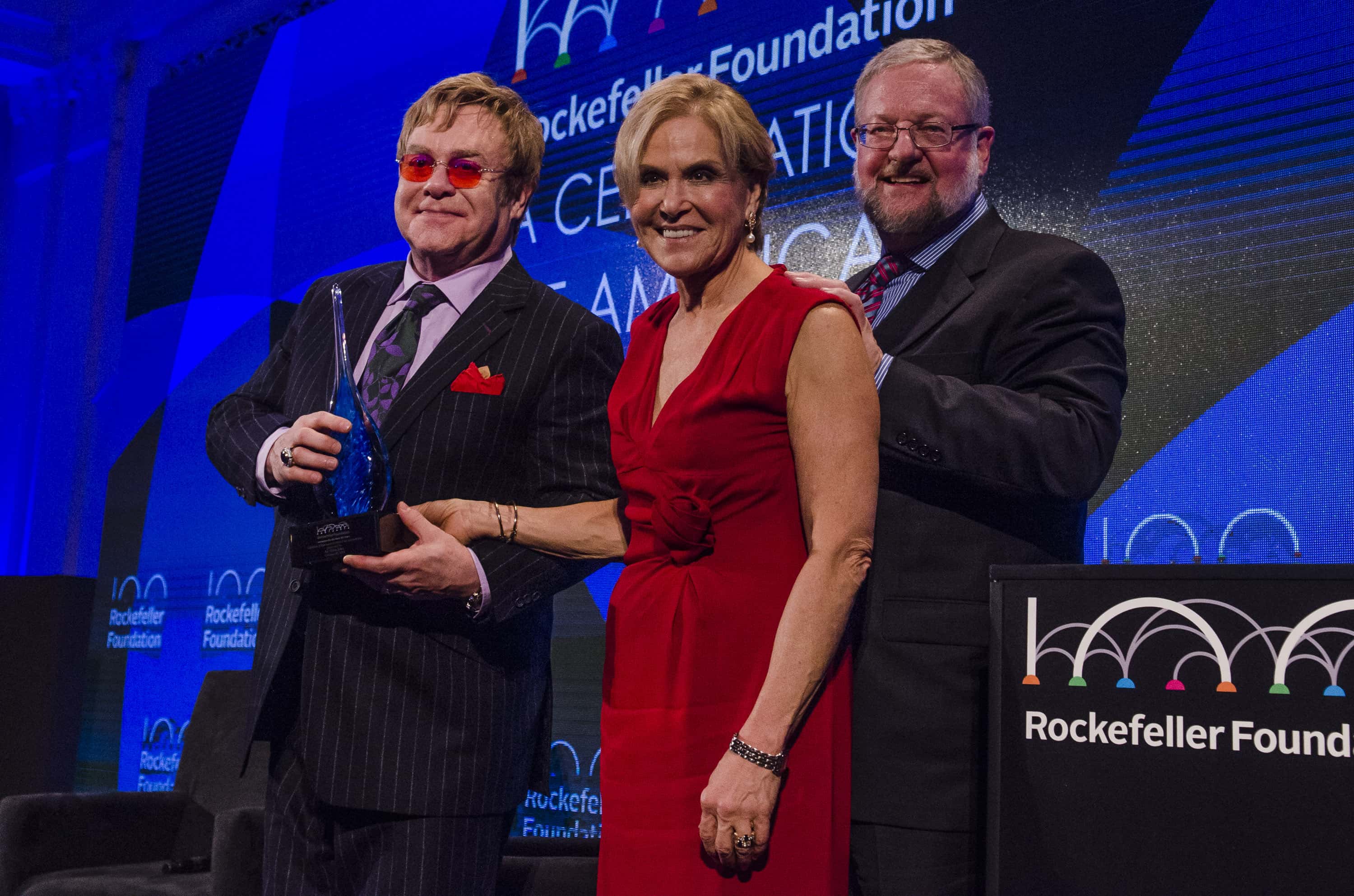 Elton John, Judith Rodin and David Rockefeller Jr. pose for a picture - 2013