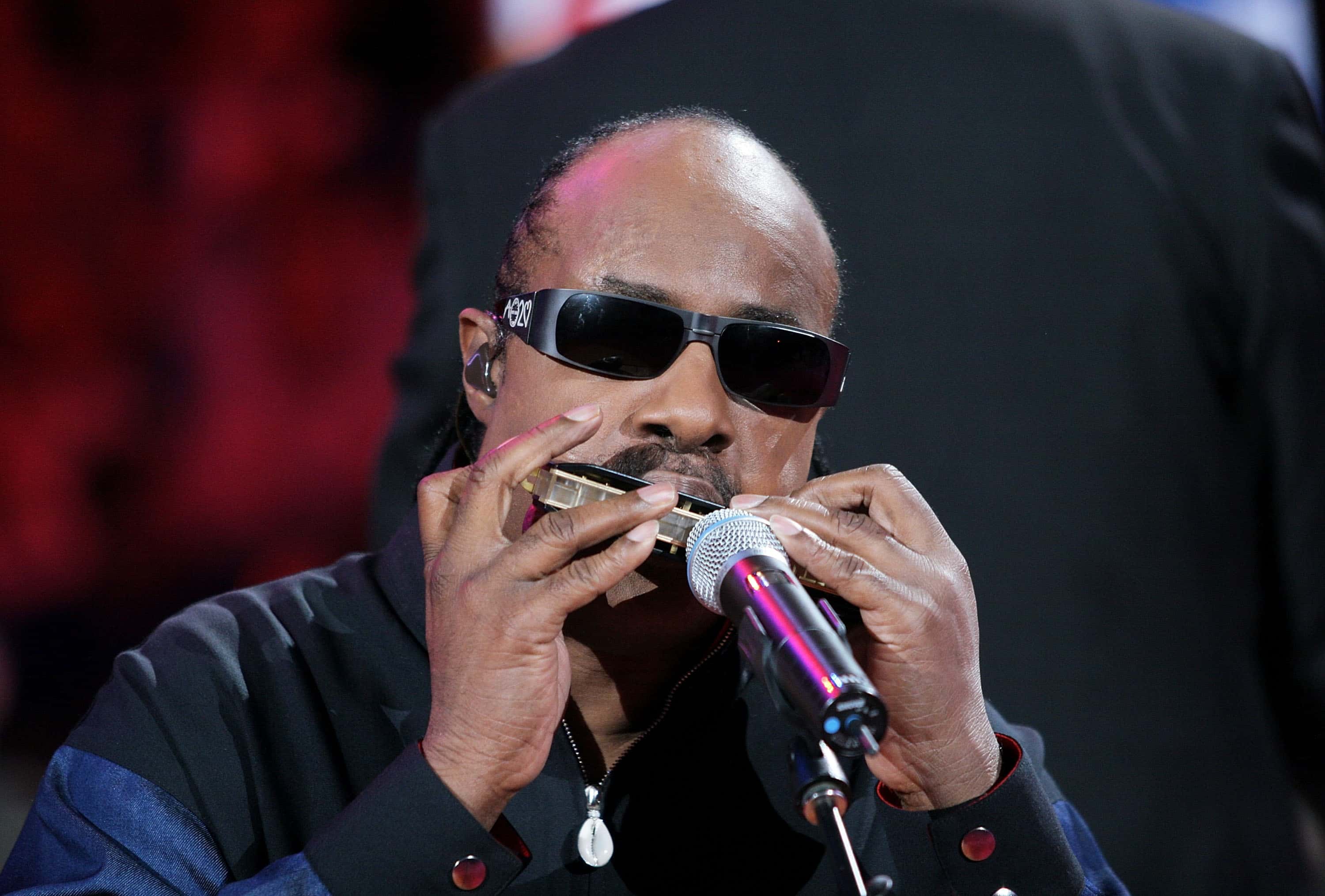 Singer Stevie Wonder performs the National Anthem on a harmonica - 2005