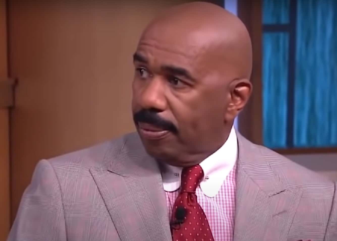 Screenshot of Steve Harvey looking at side - from Steve Harvey (2012/2017)