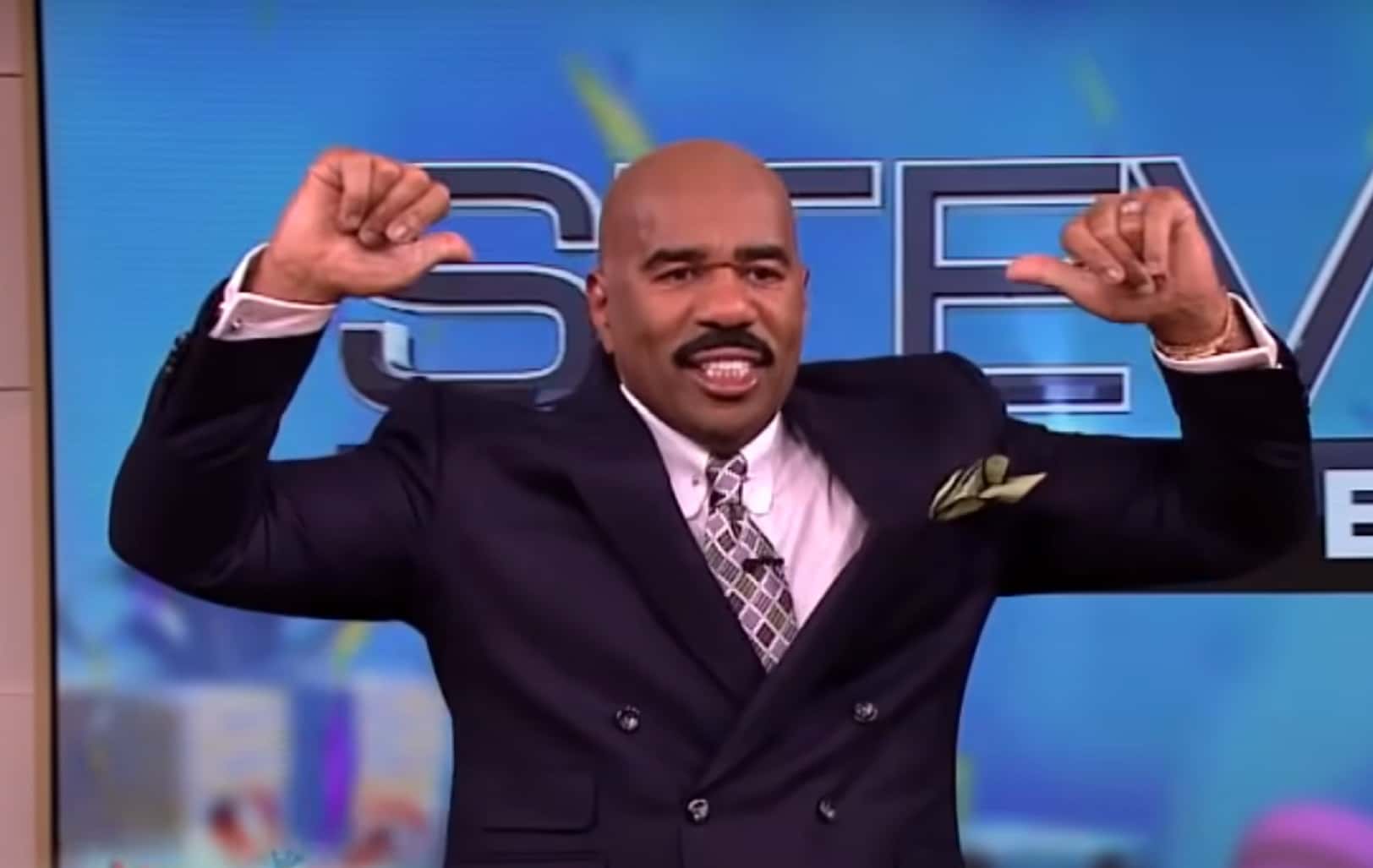 Screenshot of Steve Harvey with arms up - from Steve Harvey (2012/2017)