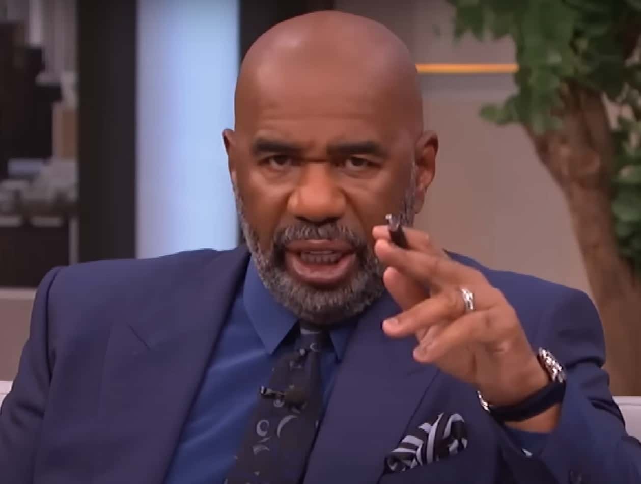 Screenshot of Steve Harvey with surprised face looking at side - from Steve Harvey (2012/2017)
