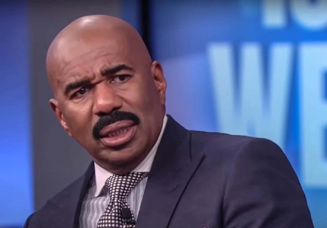 Steve Harvey talking and looknig at side - from Steve Harvey (2012/2017)