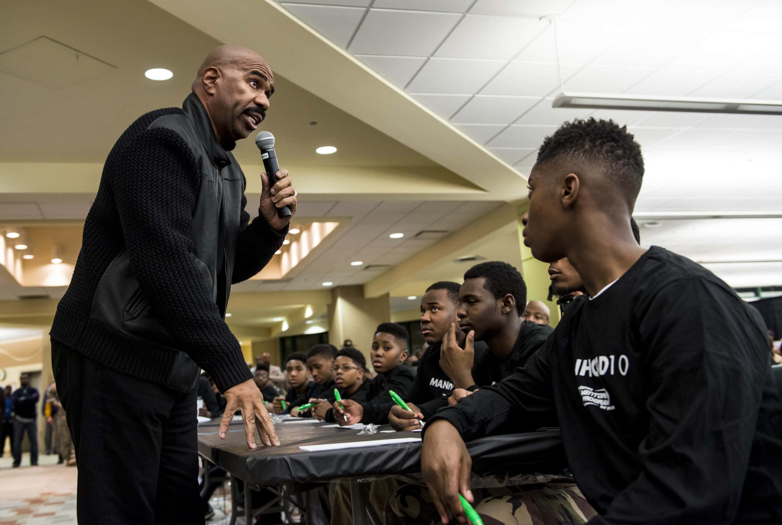 Steve Harvey talking in front of a people - 2015