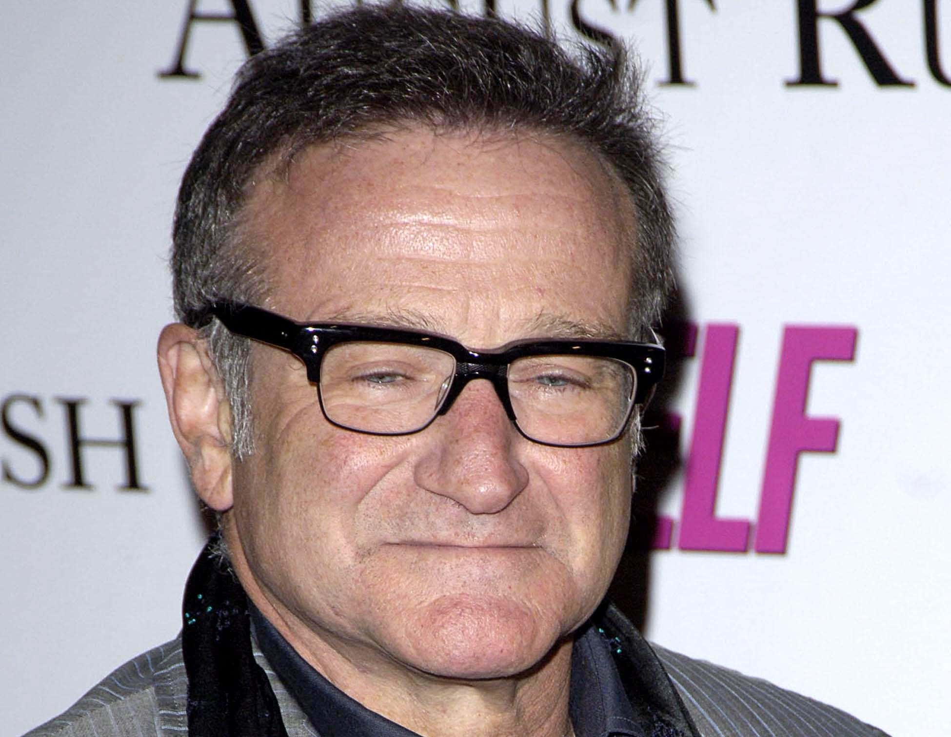 Closeup photo of Robin Williams wearing glasses