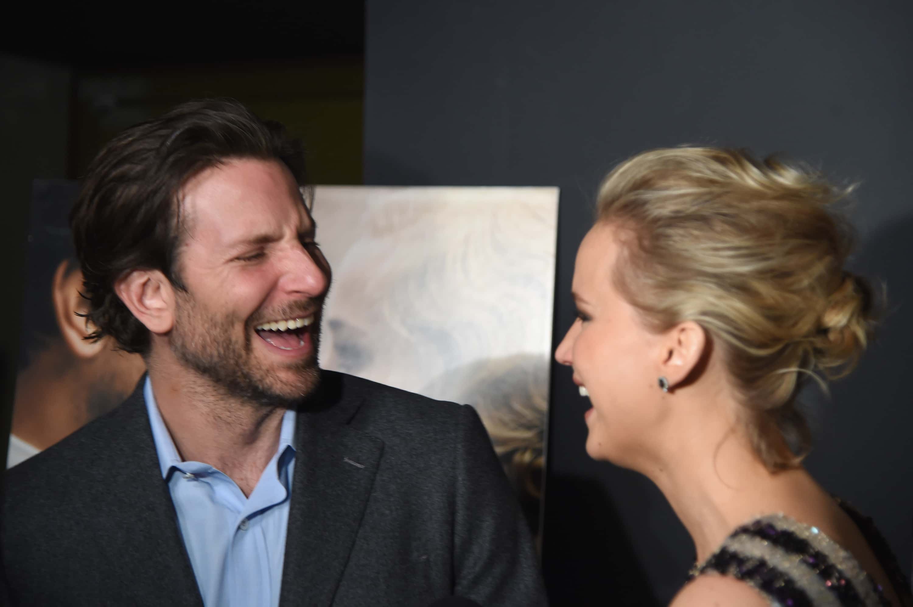 Actors Bradley Cooper and Jennifer Lawrence attend a screening