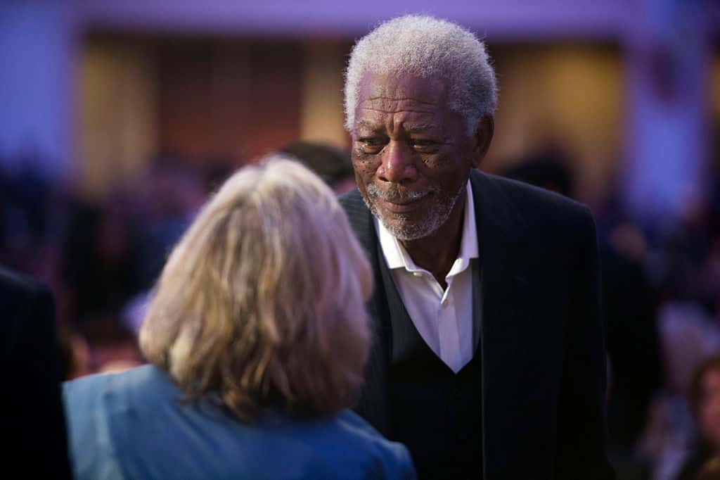 Actor Morgan Freeman greets an attendee at the National Prayer Breakfast