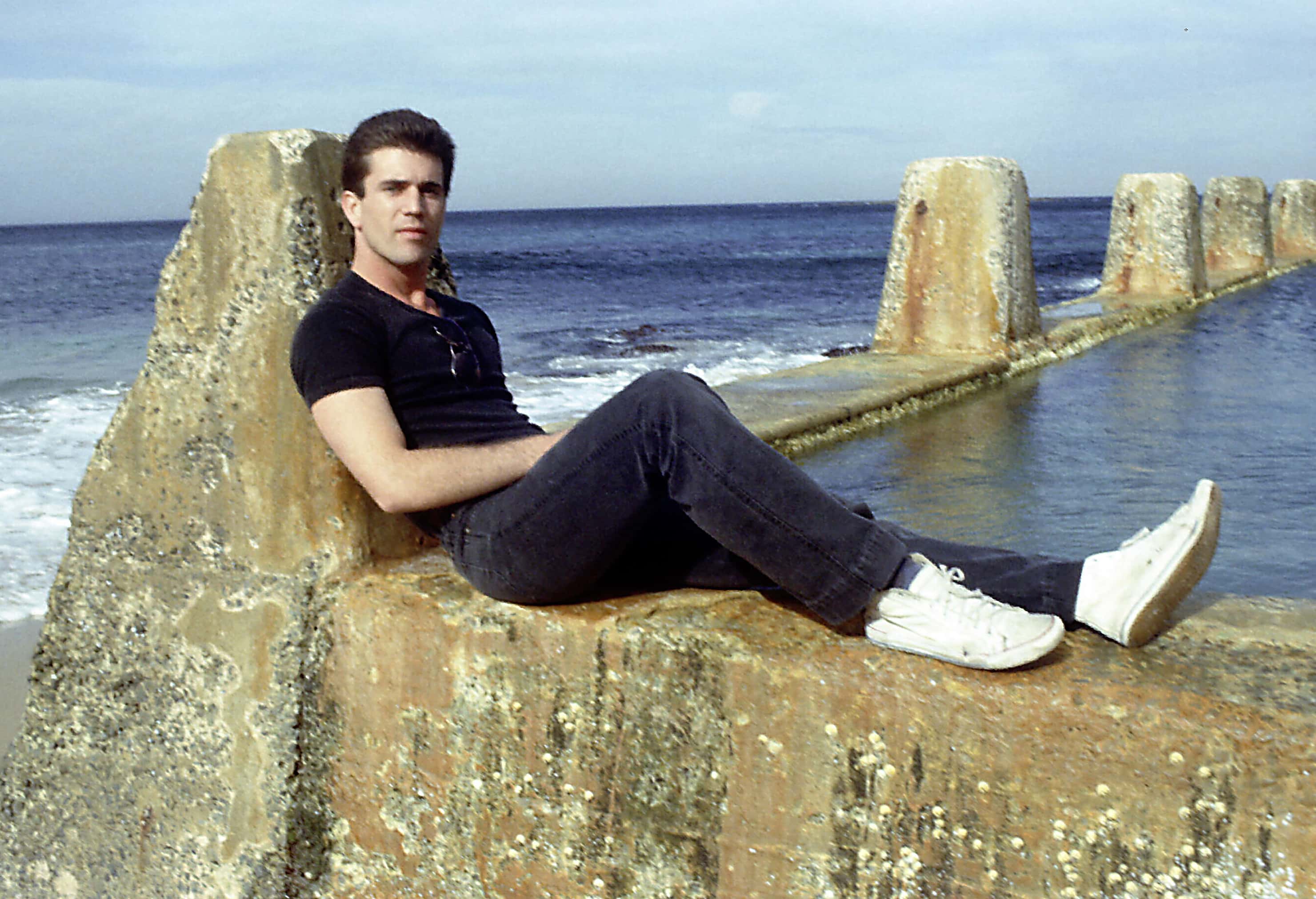 Mel Gibson poses at the Coogee Beach swimming pool in 1982 in Australia.