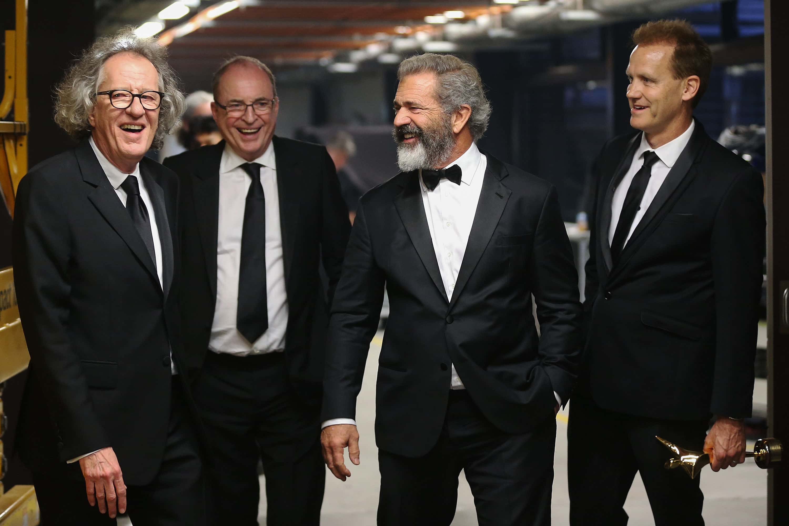 Geoffrey Rush, Bruce Davey, Mel Gibson and Paul Currie share a joke backstage