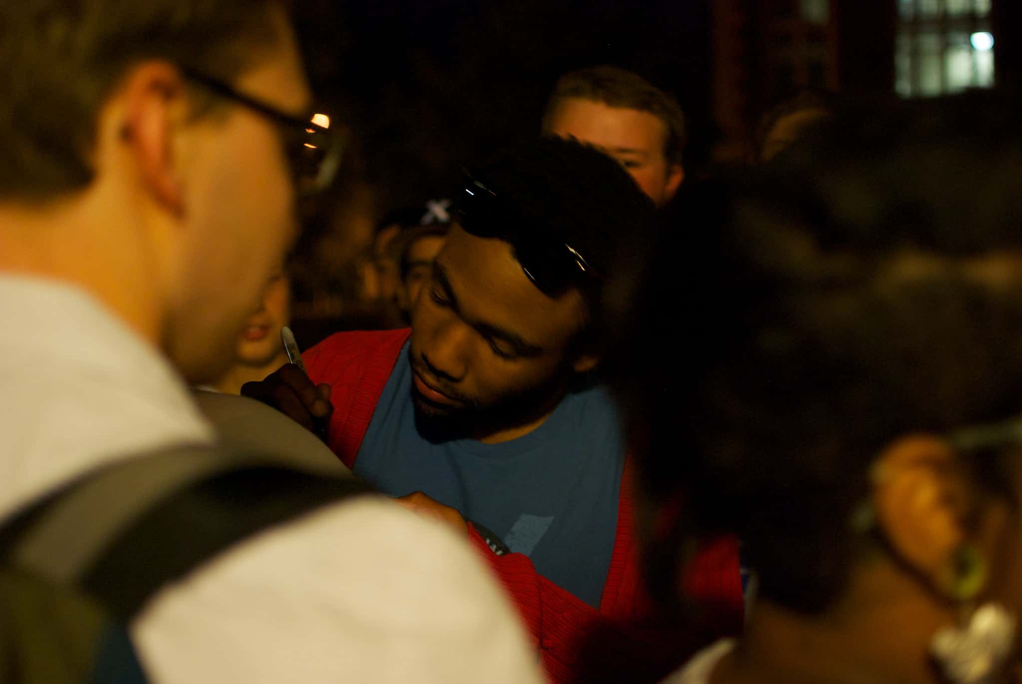Donald Glover giving autographs