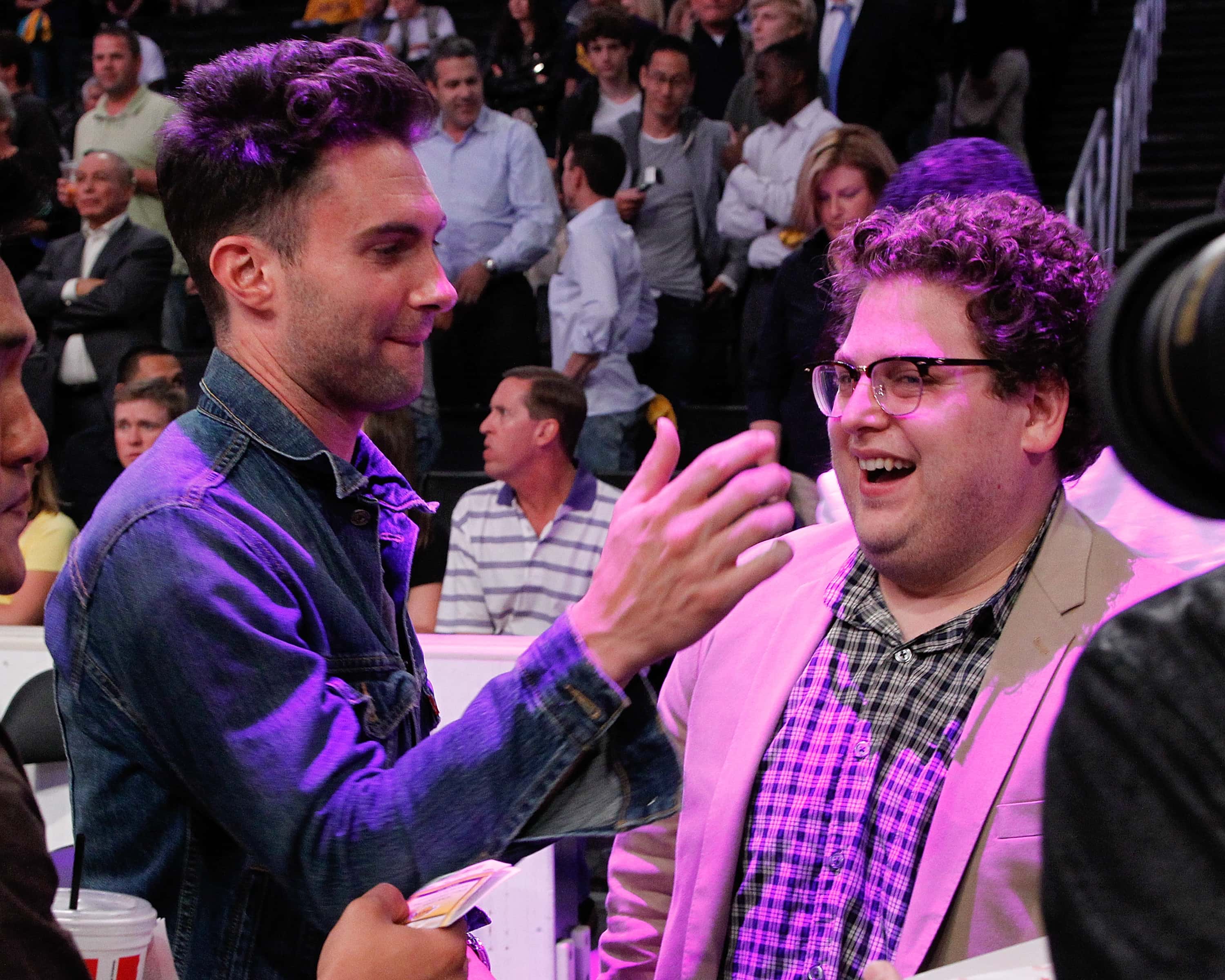 Jonah Hill (R) and Adam Levine attend 2010 NBA Playoffs Game