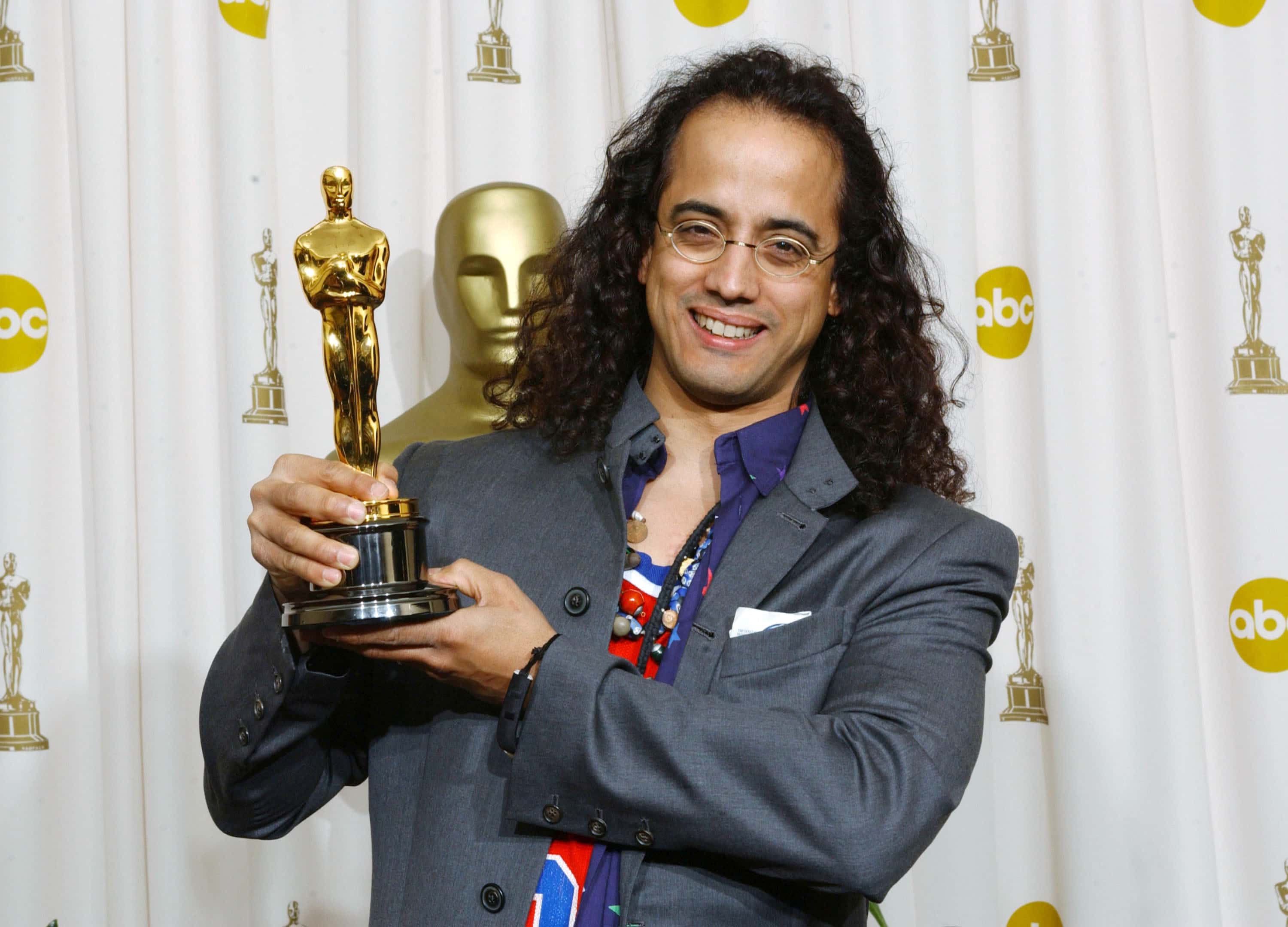 Luis Resto taking oscar for Lose Yourself