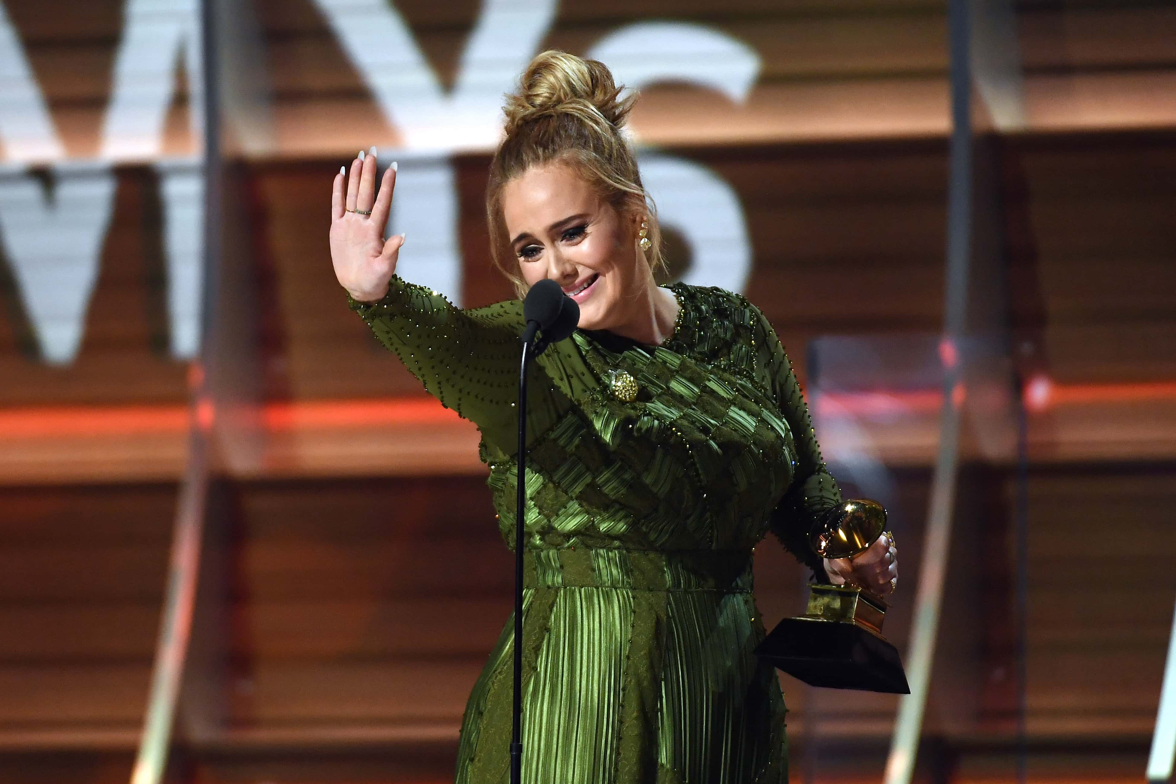 Adele accepts the award for Record of the Year 