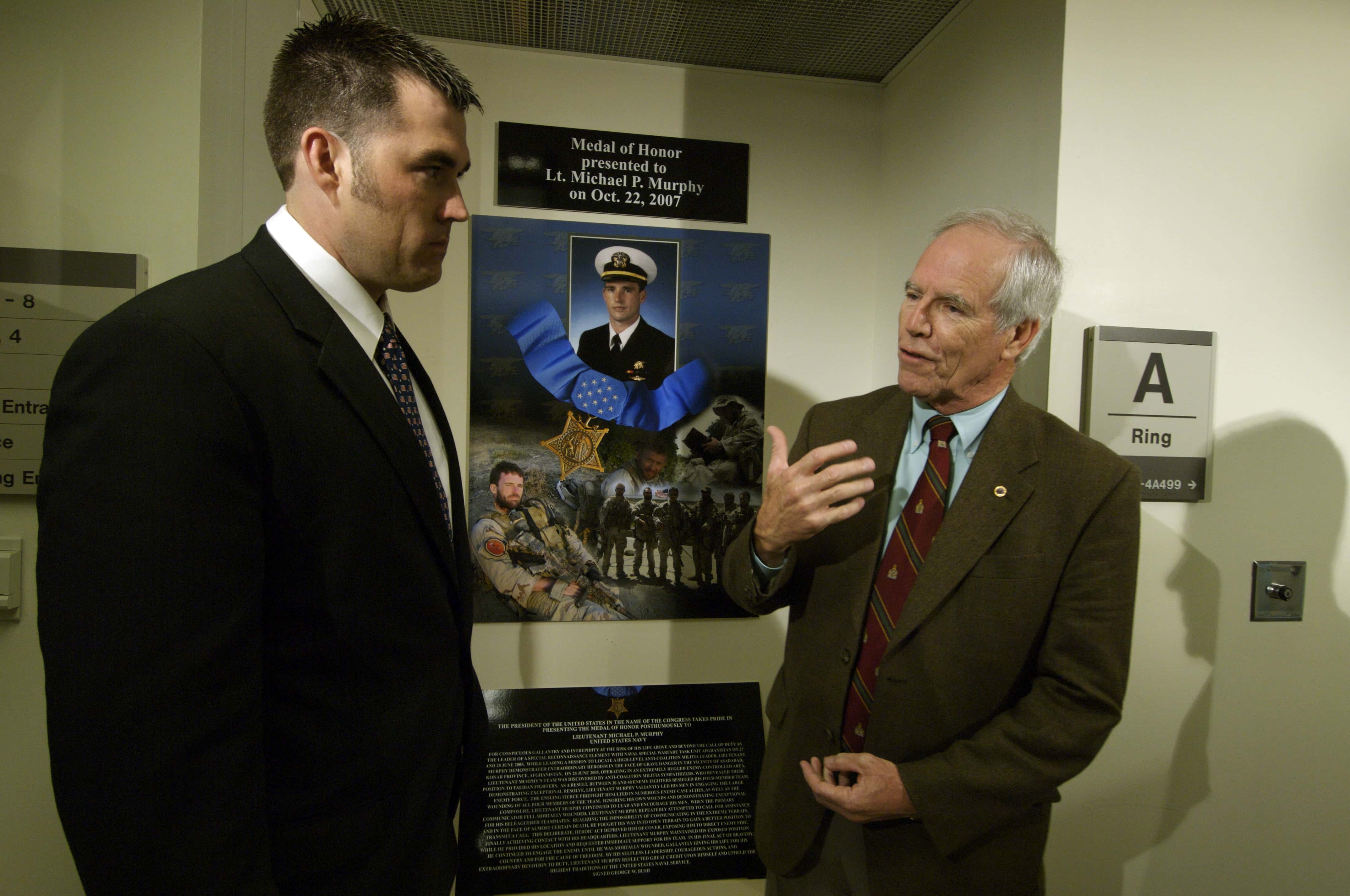 US_Navy_071023-N-5319A-060_Daniel_Murphy_father_of_Navy_SEAL_Lt._Michael_Murphy_speaks_to_former_Navy_SEAL_Marcus_Luttrell_as_they_view_a_display_dedicated_to_Lt._Murphy_during_a_tour_of_the_Pentagon.jpg