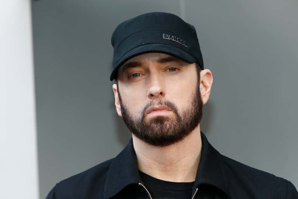 Eminem wearing black cap