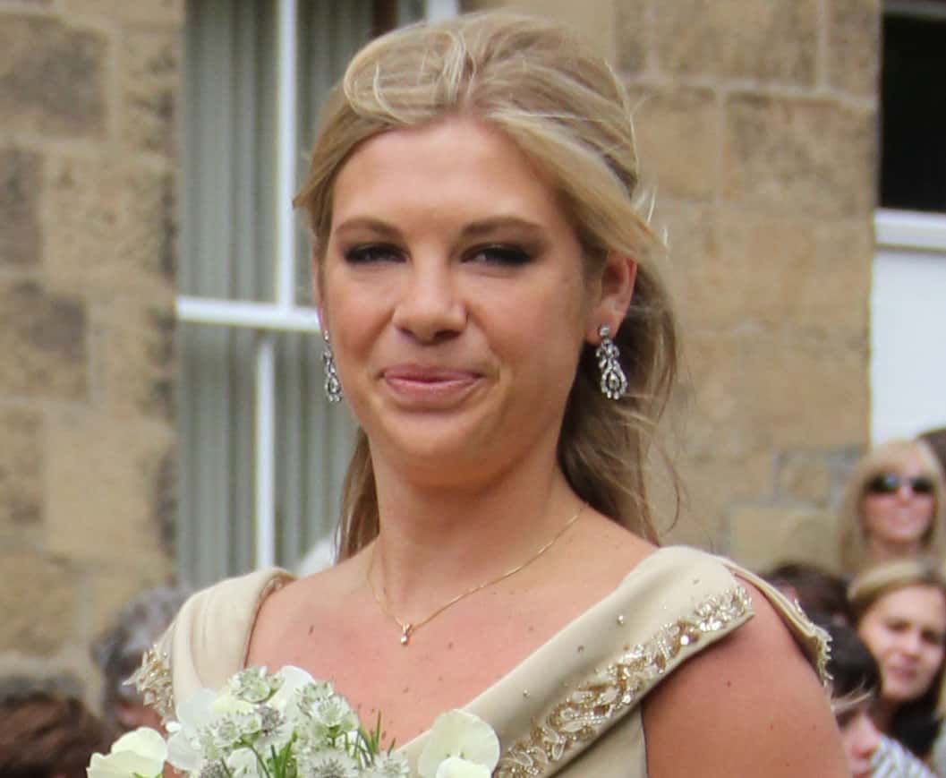 Chelsy Davy wearing a gold top