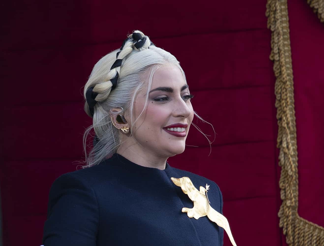 Lady Gaga smiling in black dress