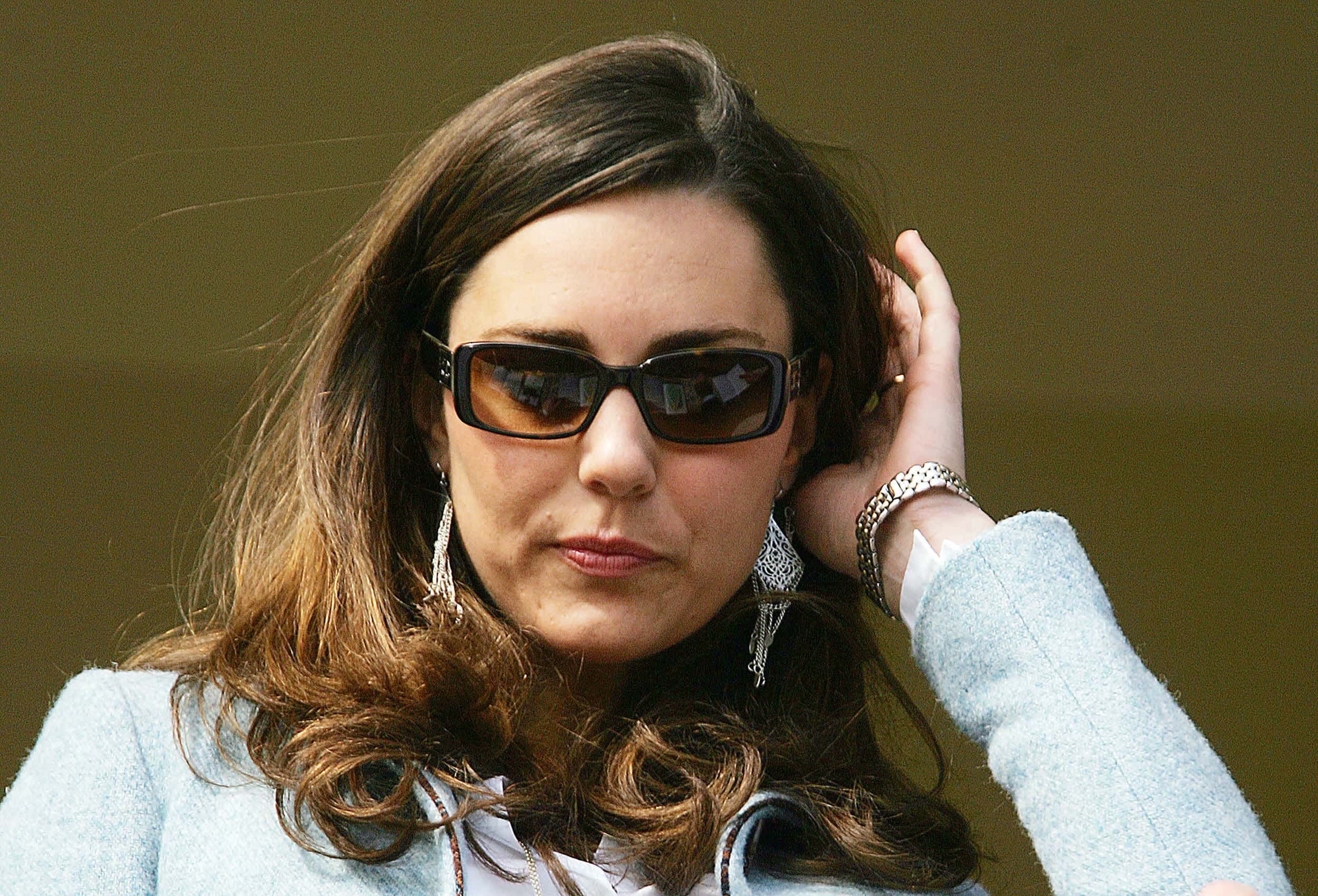 Britain Prince William's girlfriend Kate Middleton stands in the royal box