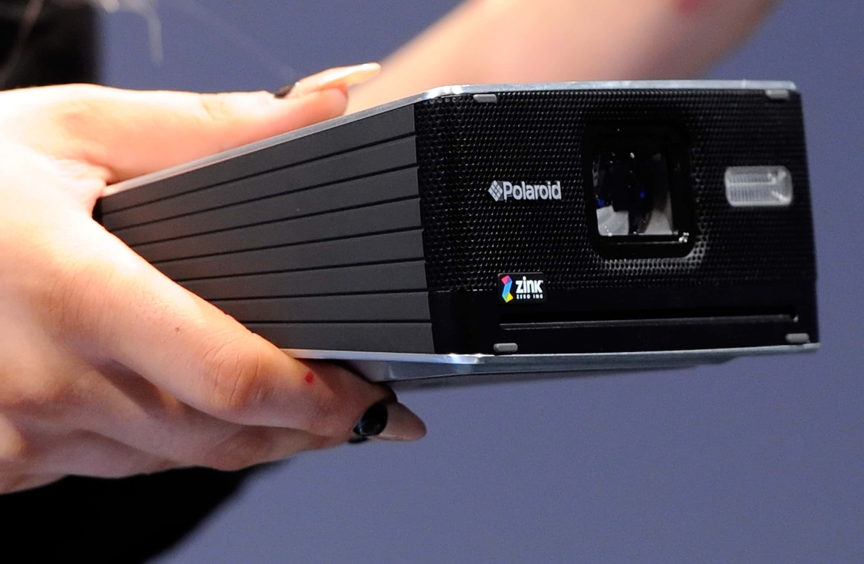 Lady Gaga displays the GL30 Instant Digital Camera