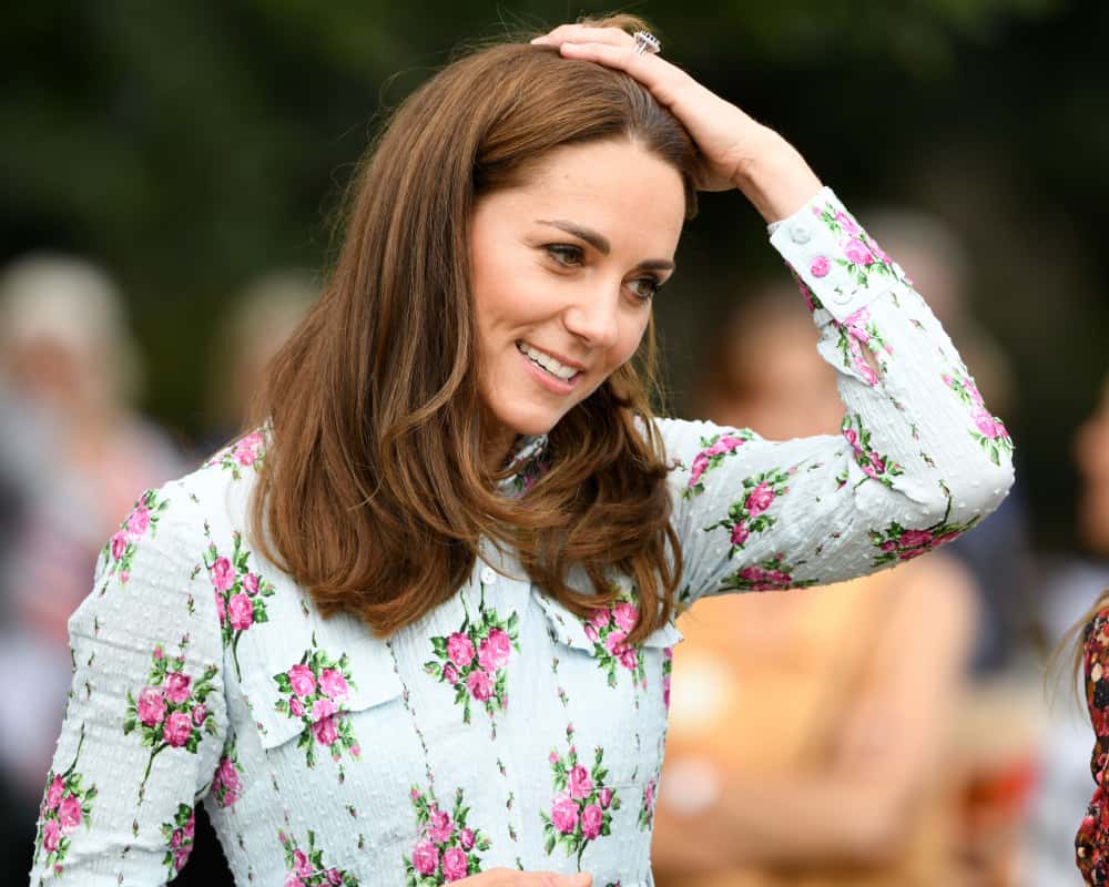 Kate Middleton wearing a white shirt with flowers