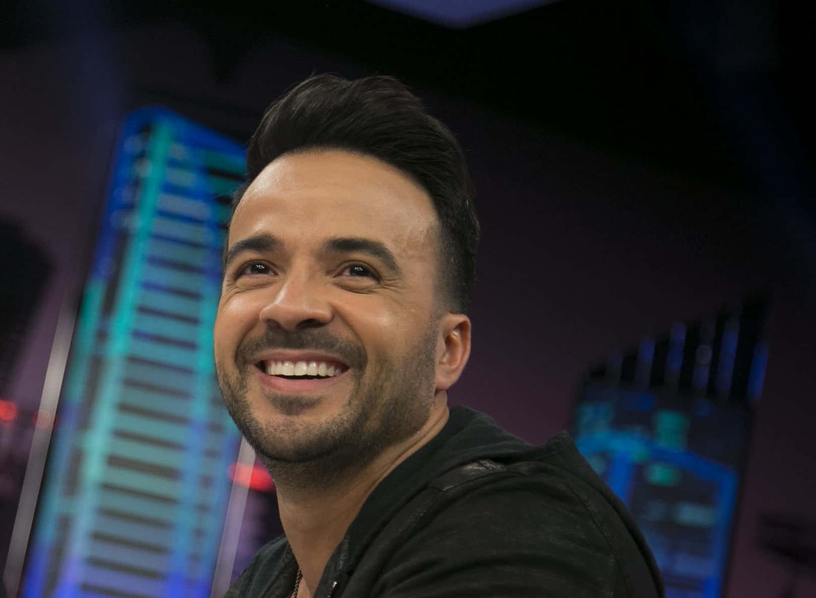 Portrait Photo of Luis Fonsi in a dark suit
