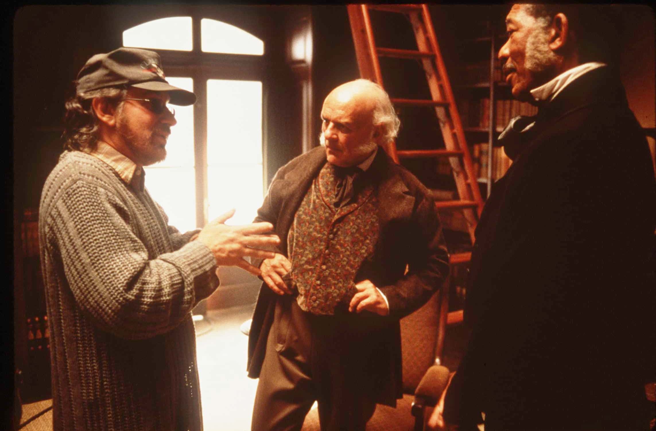 Director Steven Spielberg (Left) Goes Over A Scene With Stars Anthony Hopkins (Center) And Morgan Freeman