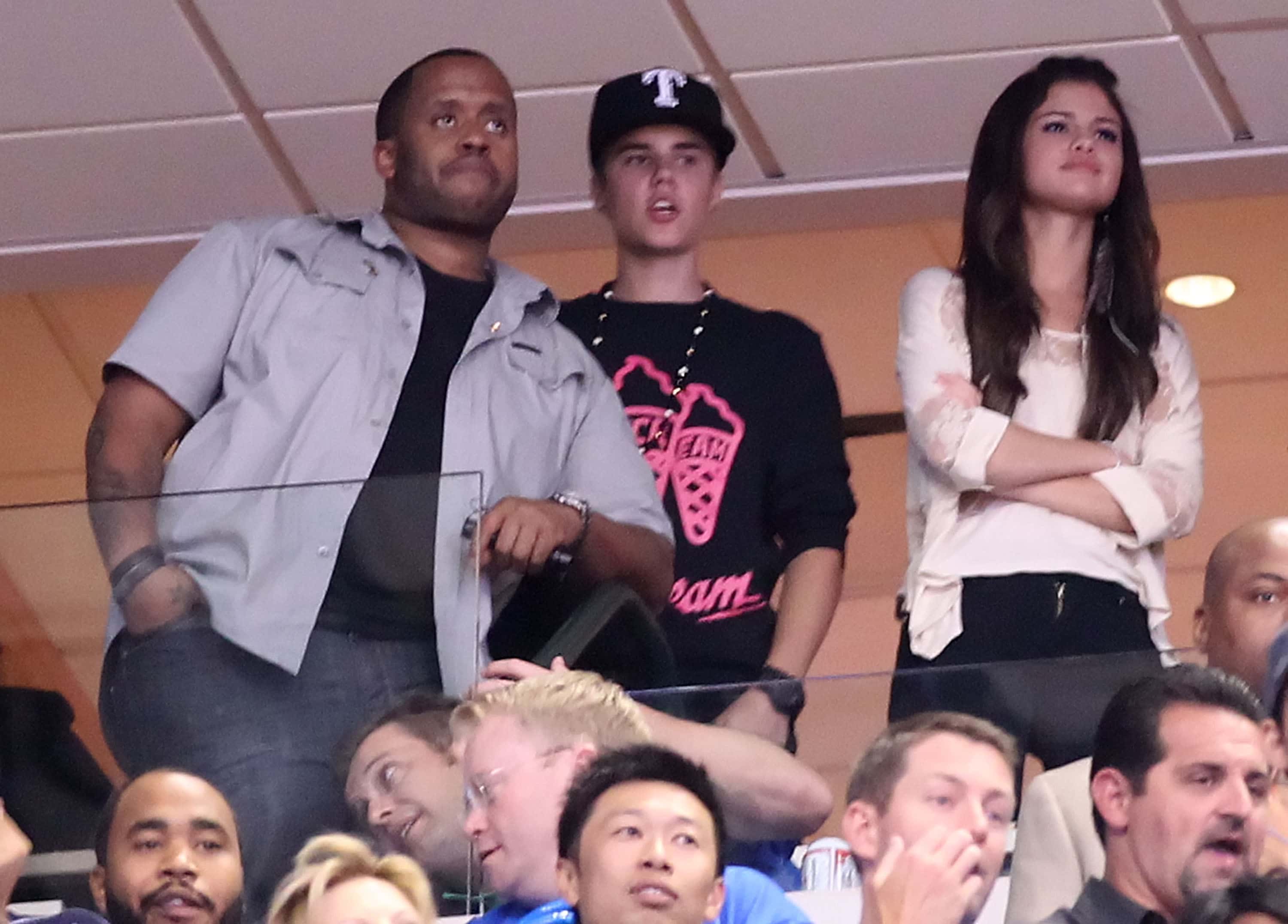 Kenny Hamilton and Singers Justin Bieber and Selena Gomez attend Game Four of the 2011 NBA Finals