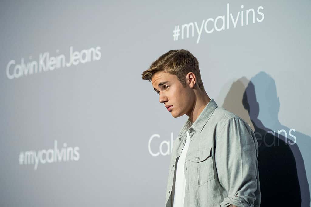 Justin Bieber poses on the red carpet at the Calvin Klein Jeans music event