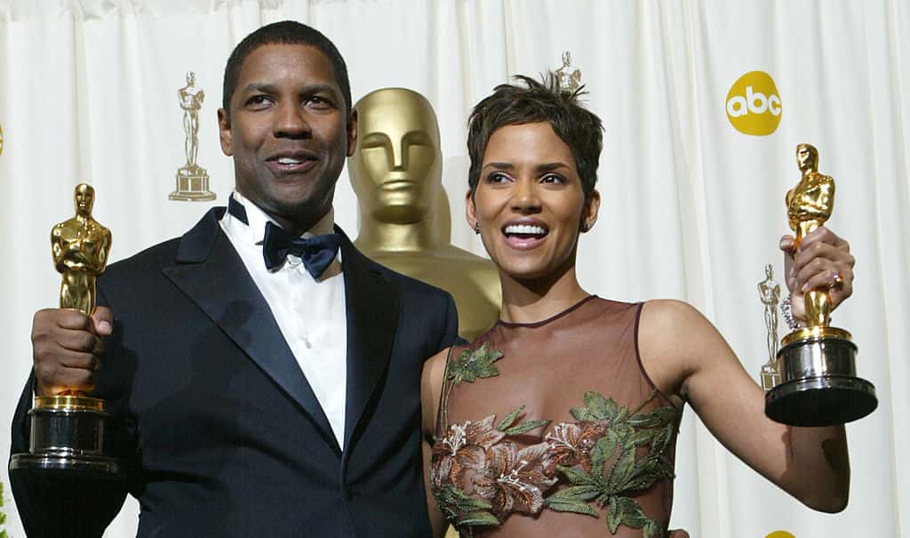 Best Actor and Actress winners Halle Berry and Denzel Washington pose with their Oscars