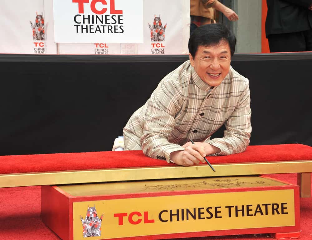 Jackie Chan has his hand & footprints set in cement in the courtyard of the TCL Chinese Theatre