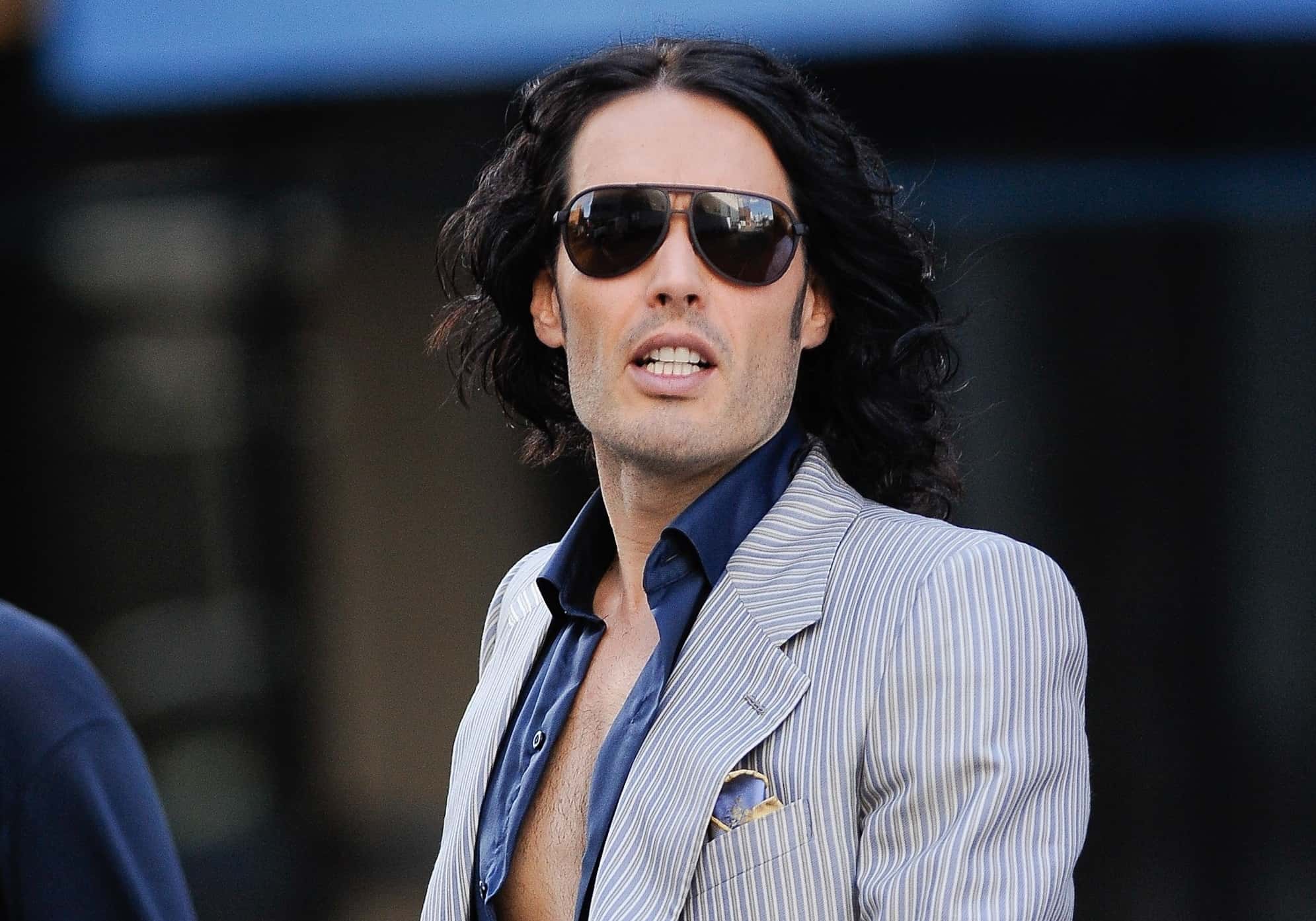Russell Brand with glasses