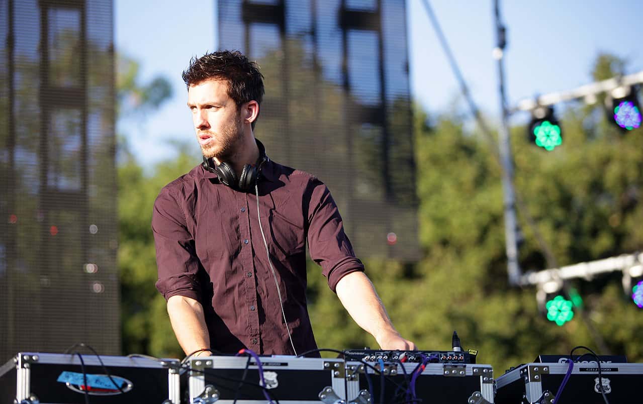 Calvin Harris wearing a brown shirt