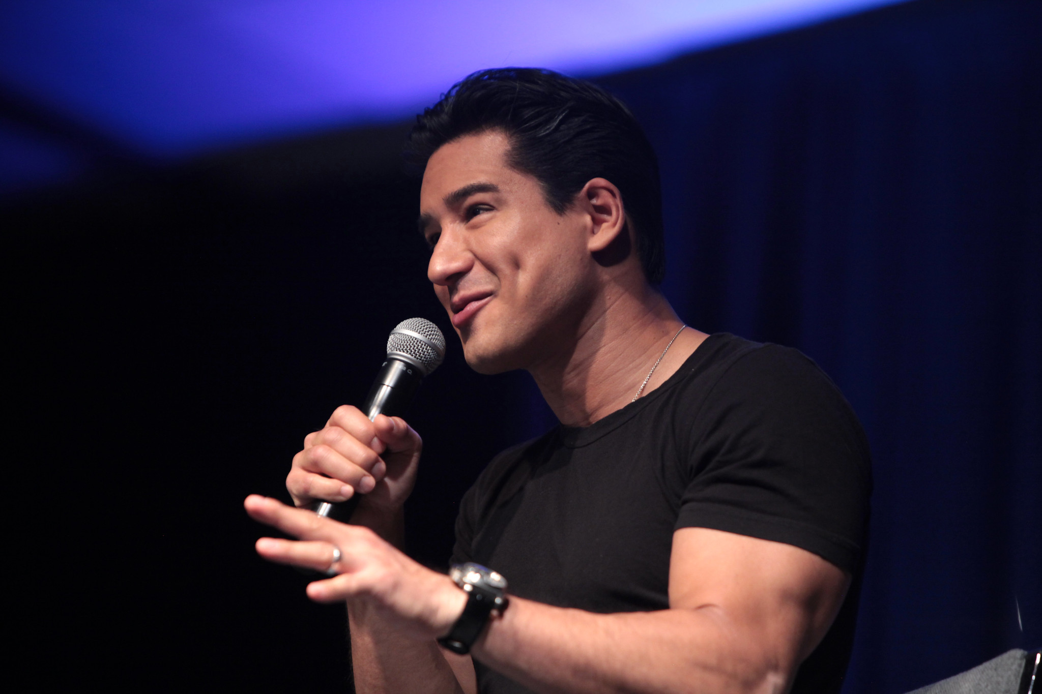 Mario Lopez speaking in front of audience