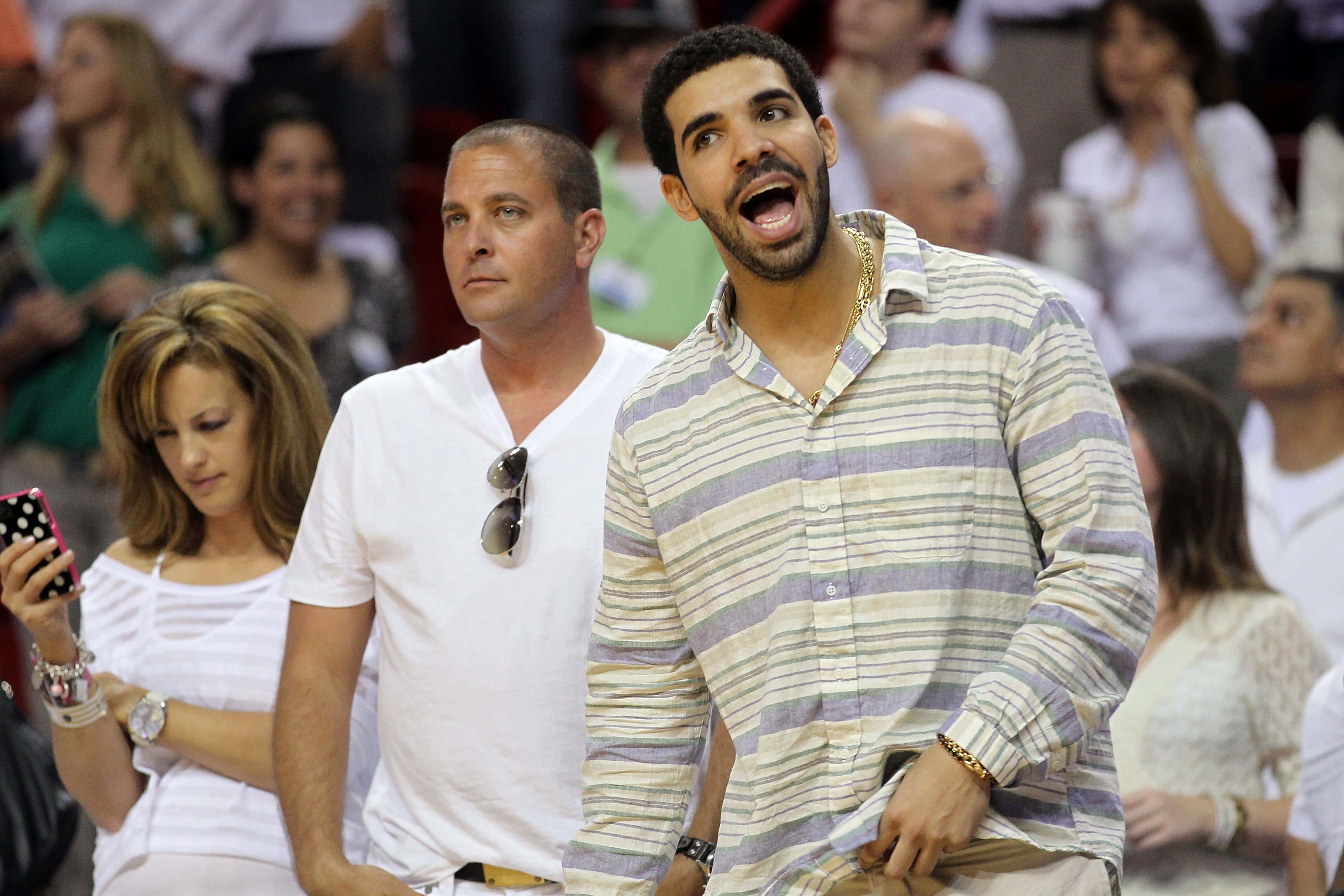 Recording artist Drake watches the Miami Heat