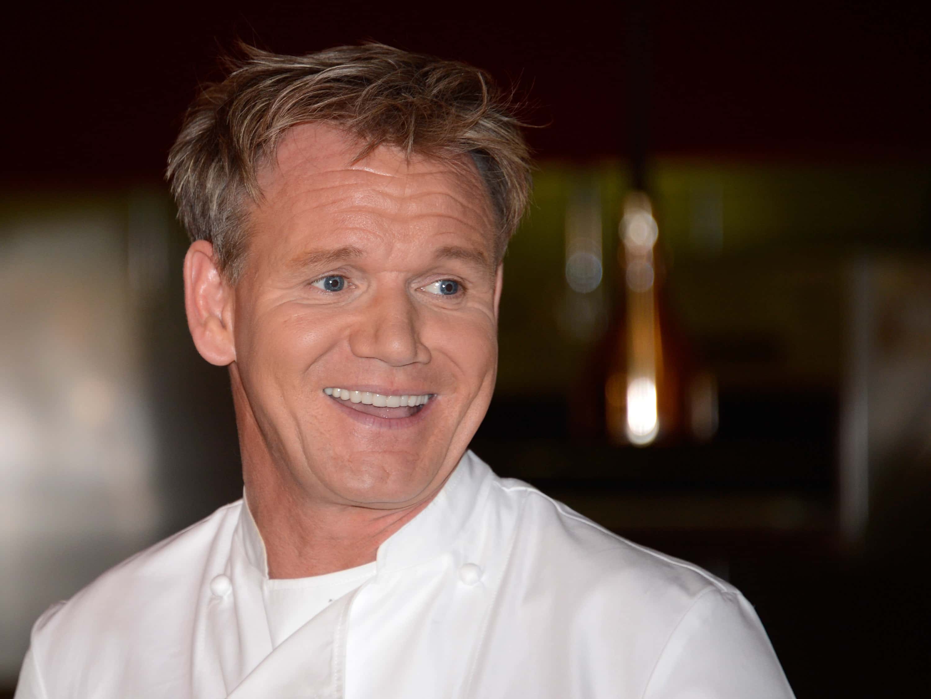 Television personality and chef Gordon Ramsay smiles during a cooking demonstration and news conference held to celebrate the opening of his first Las Vegas restaurant