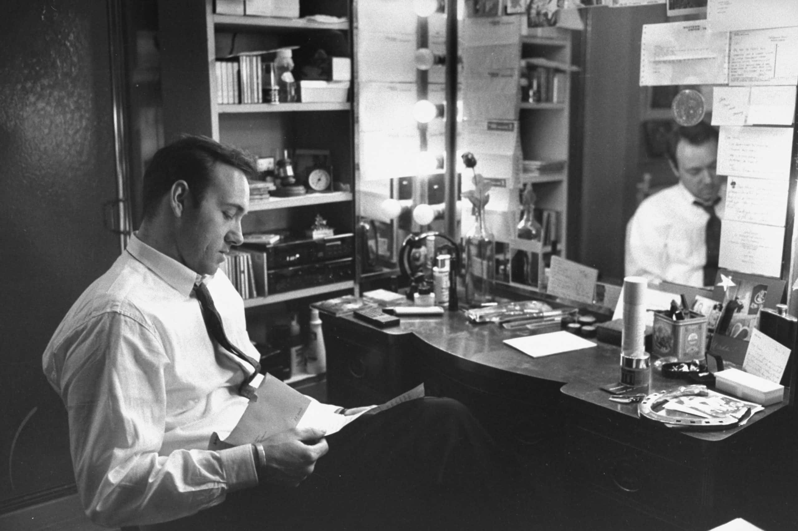 Actor Kevin Spacey reading letter in his dressing room at the Richard Rodgers Theater 