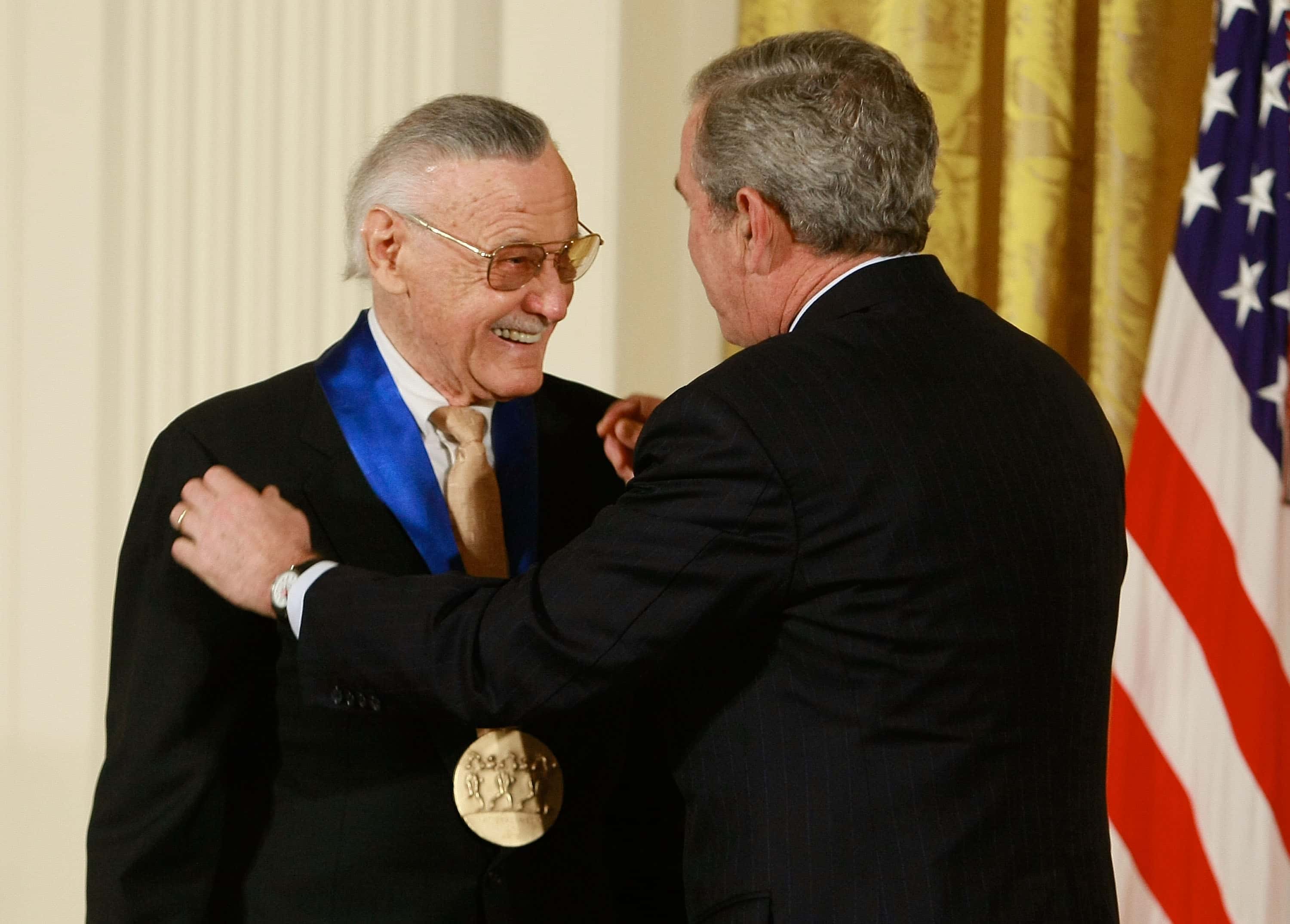 U.S. President George W. Bush congratulates Stan Lee