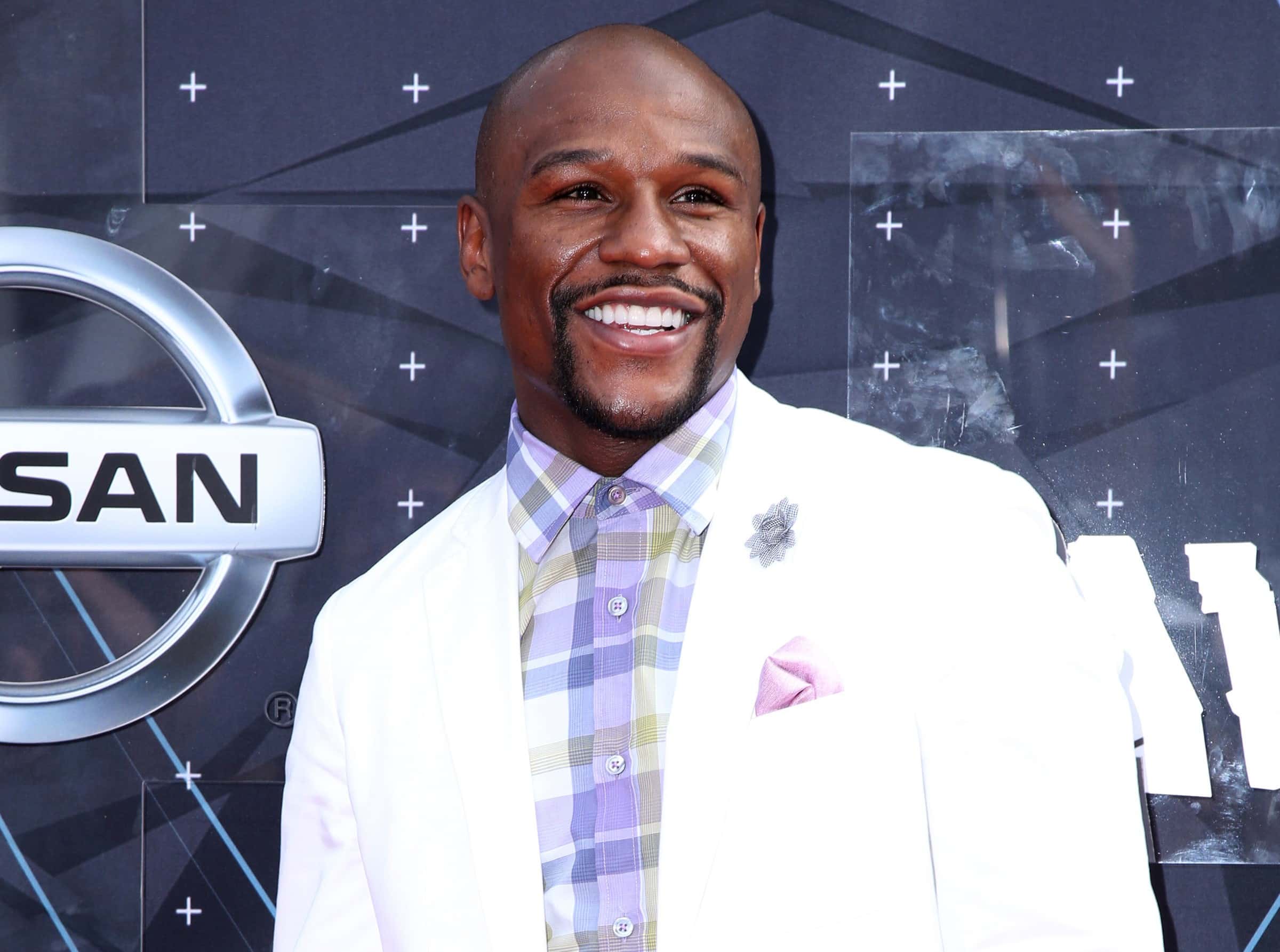 Floyd Mayweather Jr. posing for a photo