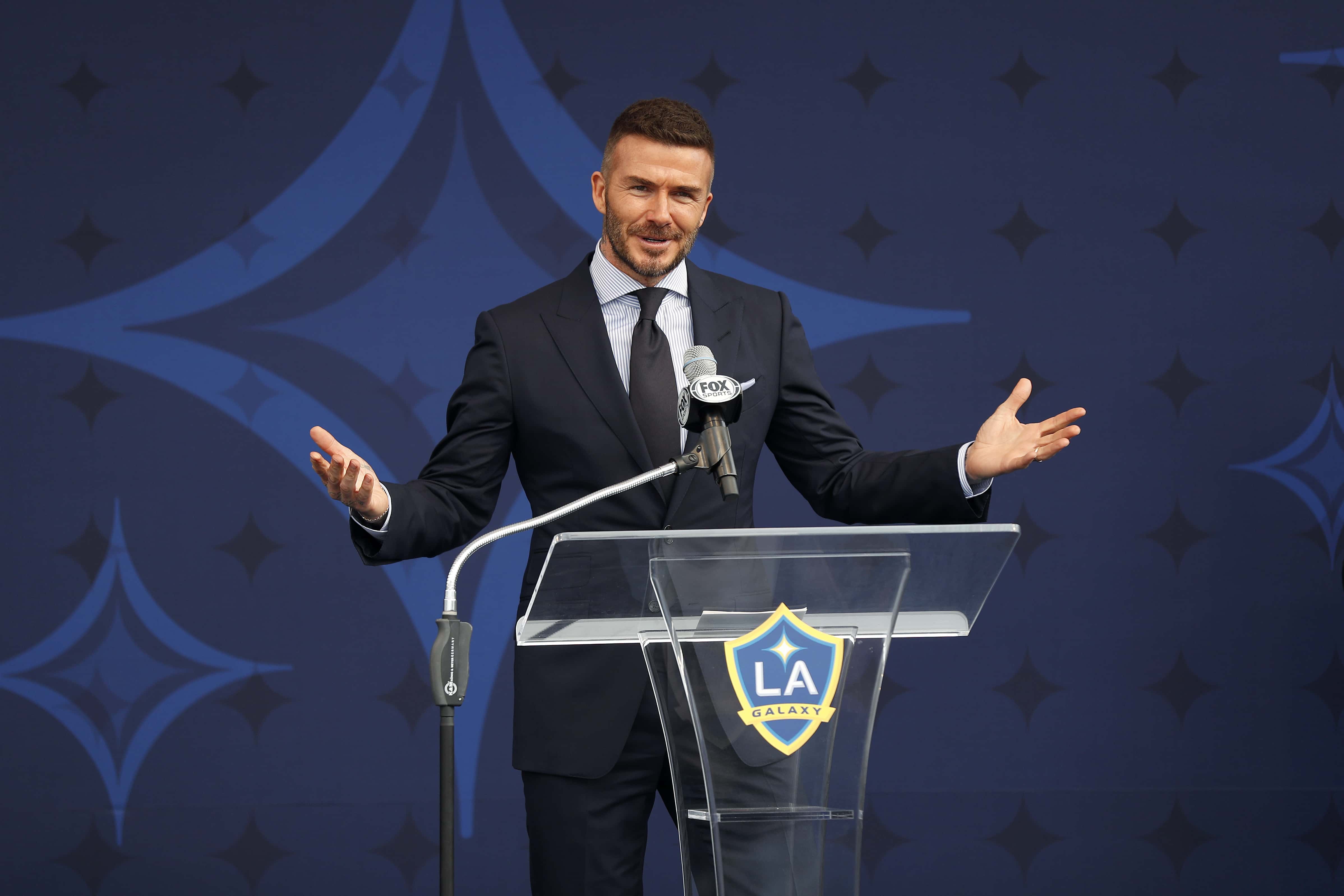 Former professional soccer midfielder David Beckham speaks at the unveiling of his statue