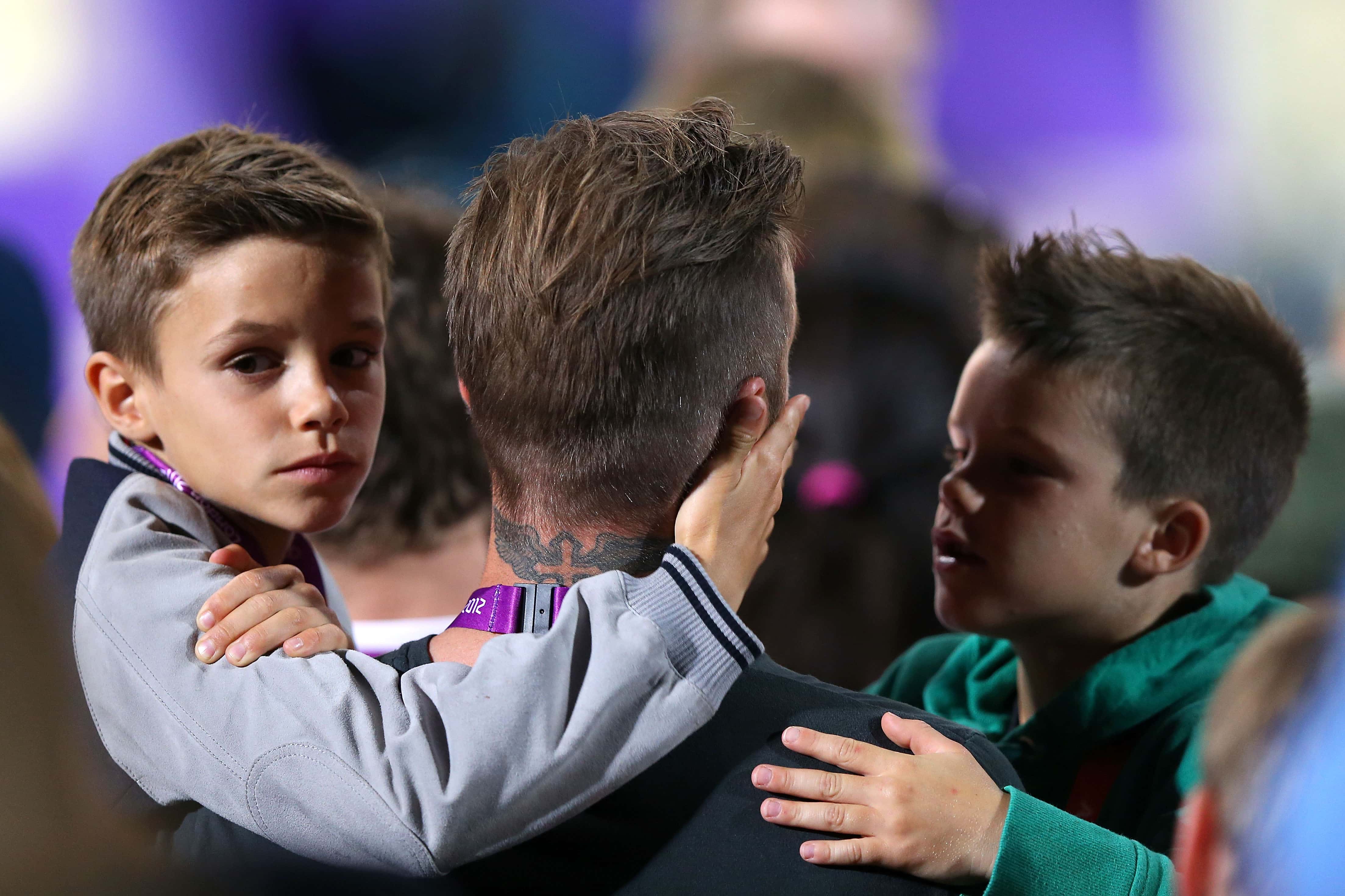 Brooklyn Beckham, David Beckham and Cruz Beckham attend the Women's Beach Volleyball match
