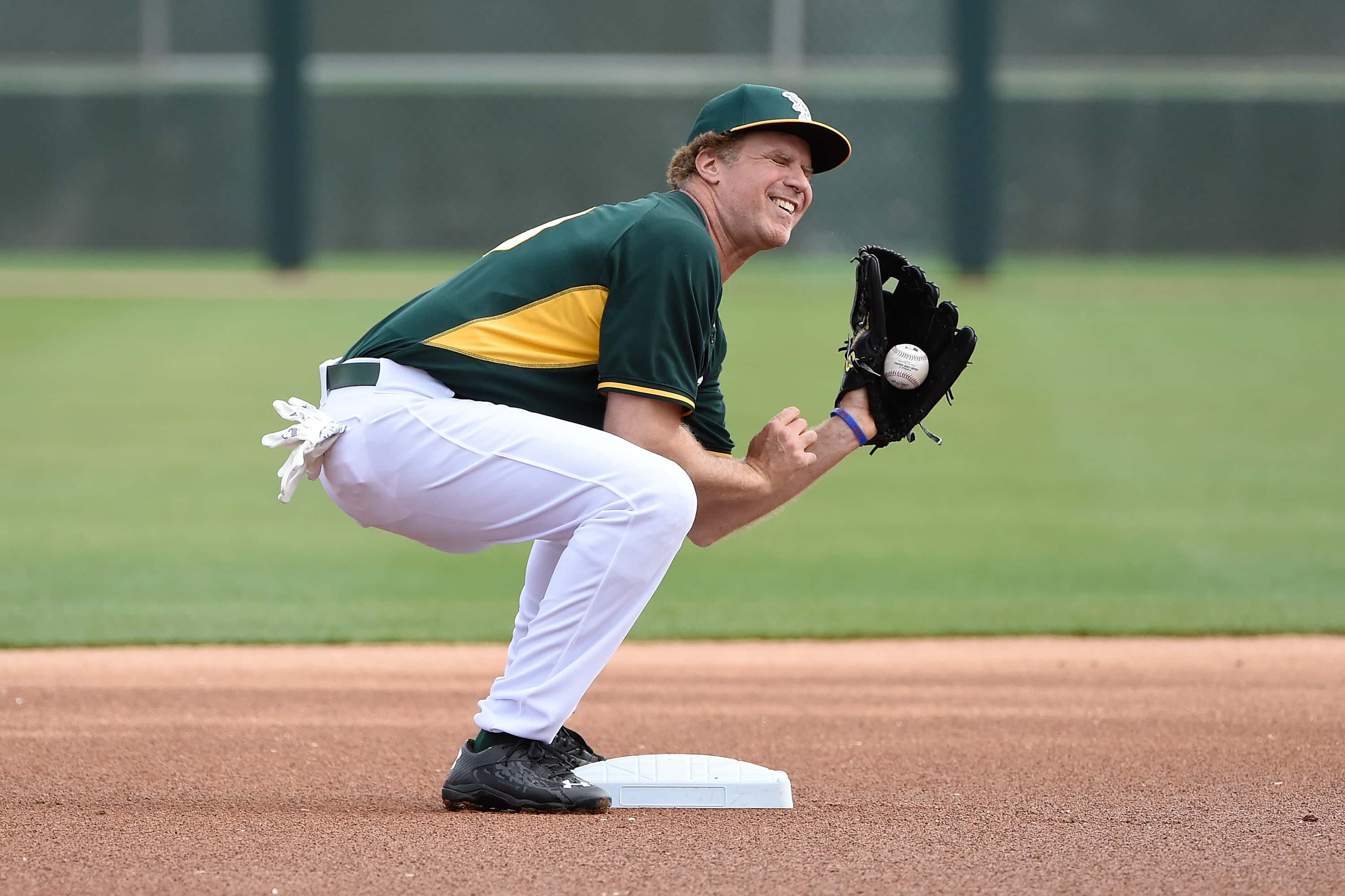 Actor Will Ferrell plays with the Oakland Athletics