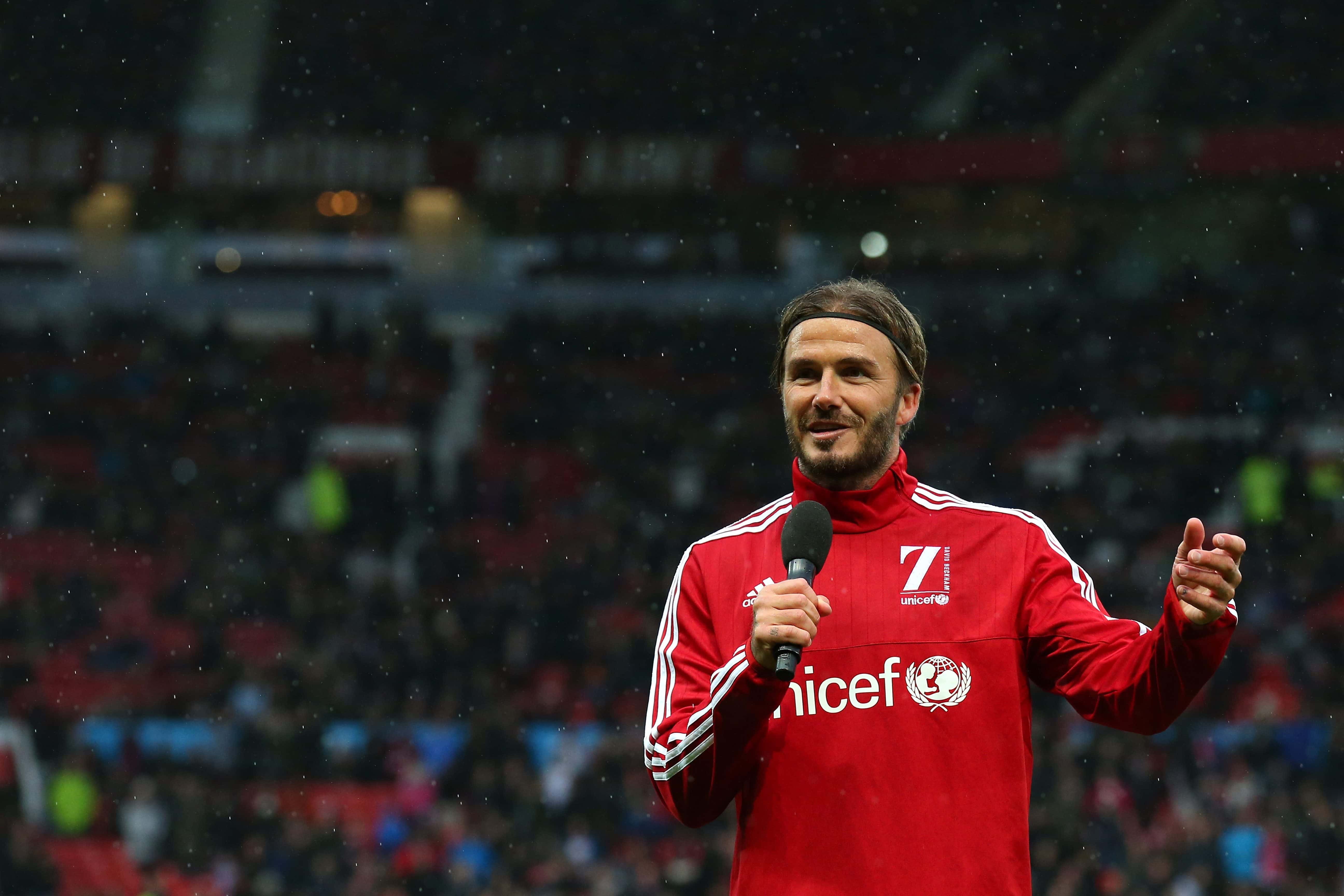 David Beckham of Great Britain and Ireland addresses the fans during the David Beckham Match for Children