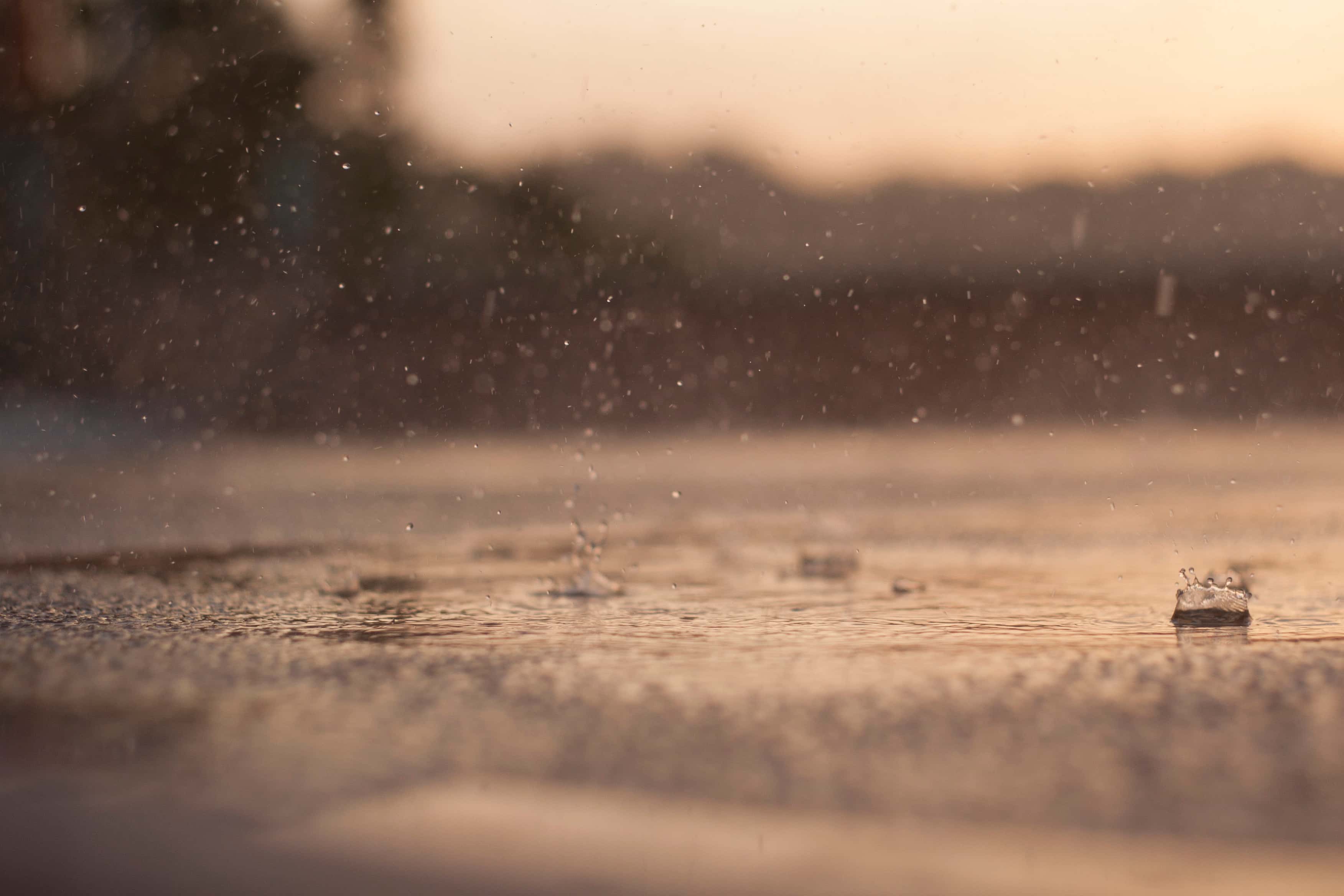 Rain Drops Falling On Street.