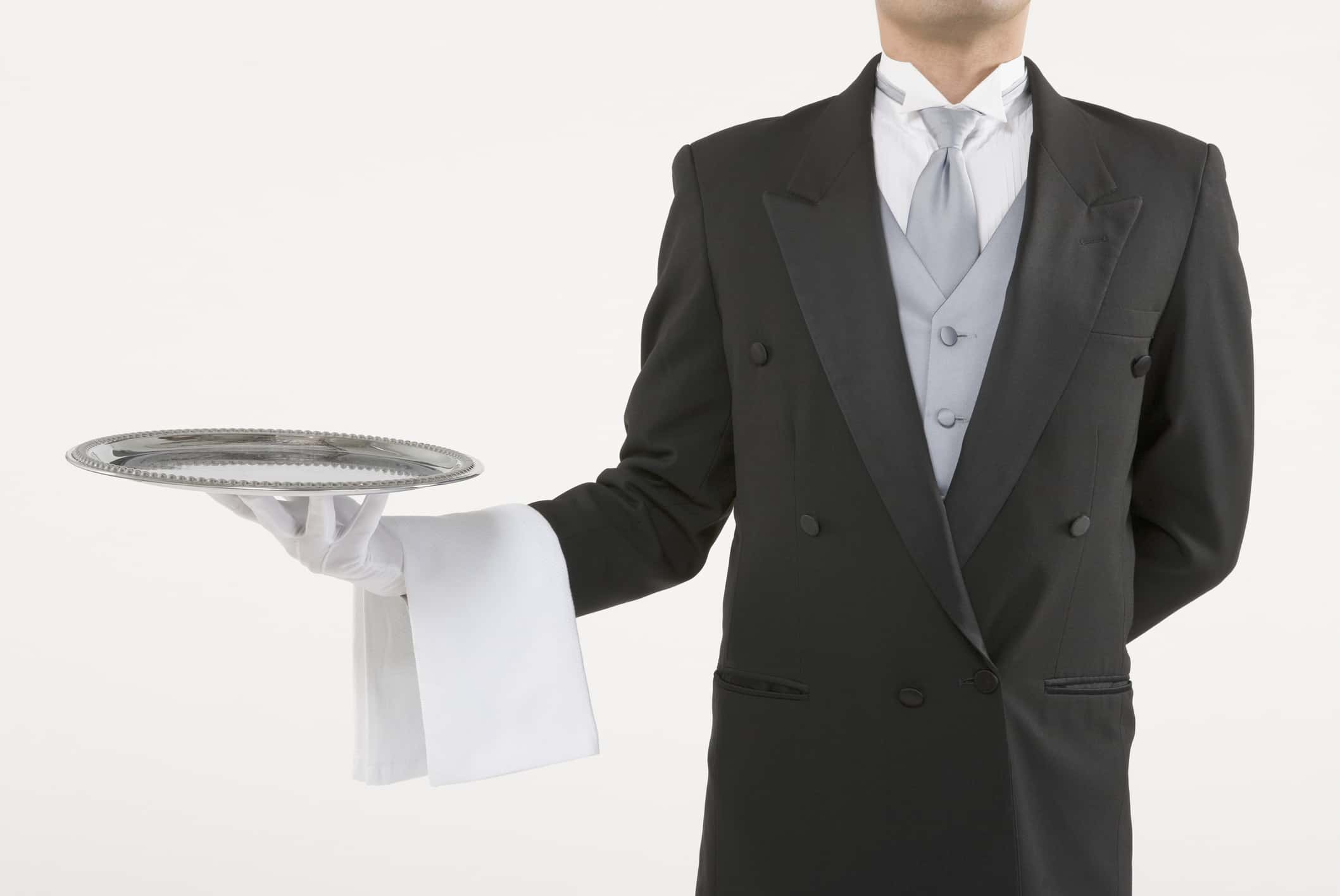 Butler holding an empty silver tray.