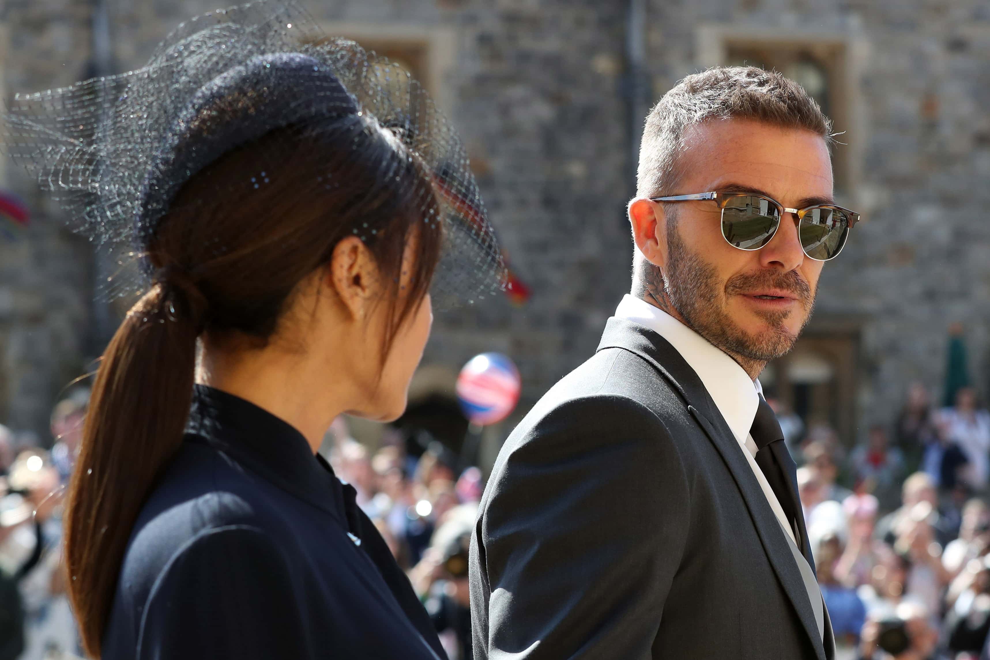 David Beckham and Victoria Beckham arrive at St George's Chapel at Windsor Castle before the wedding of Prince Harry to Meghan Markle