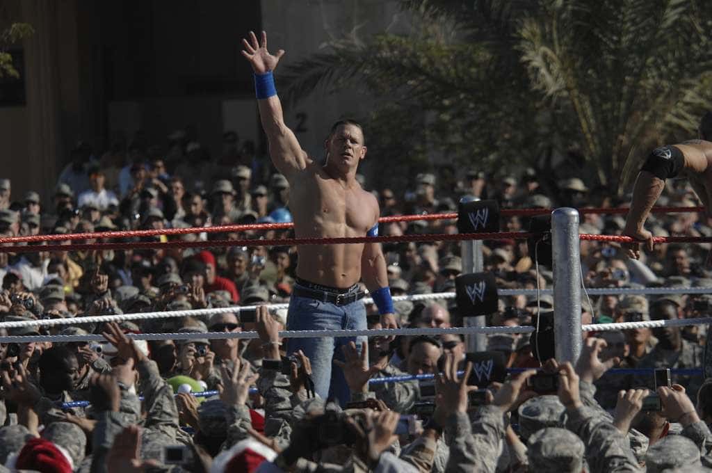 Shirtless John Cena waving
