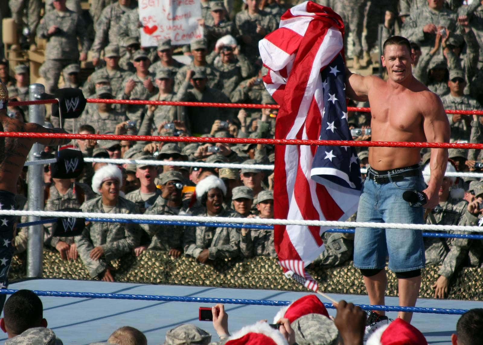 World Wrestling Entertainment's wrestler, John Cena, holds up the United States flag