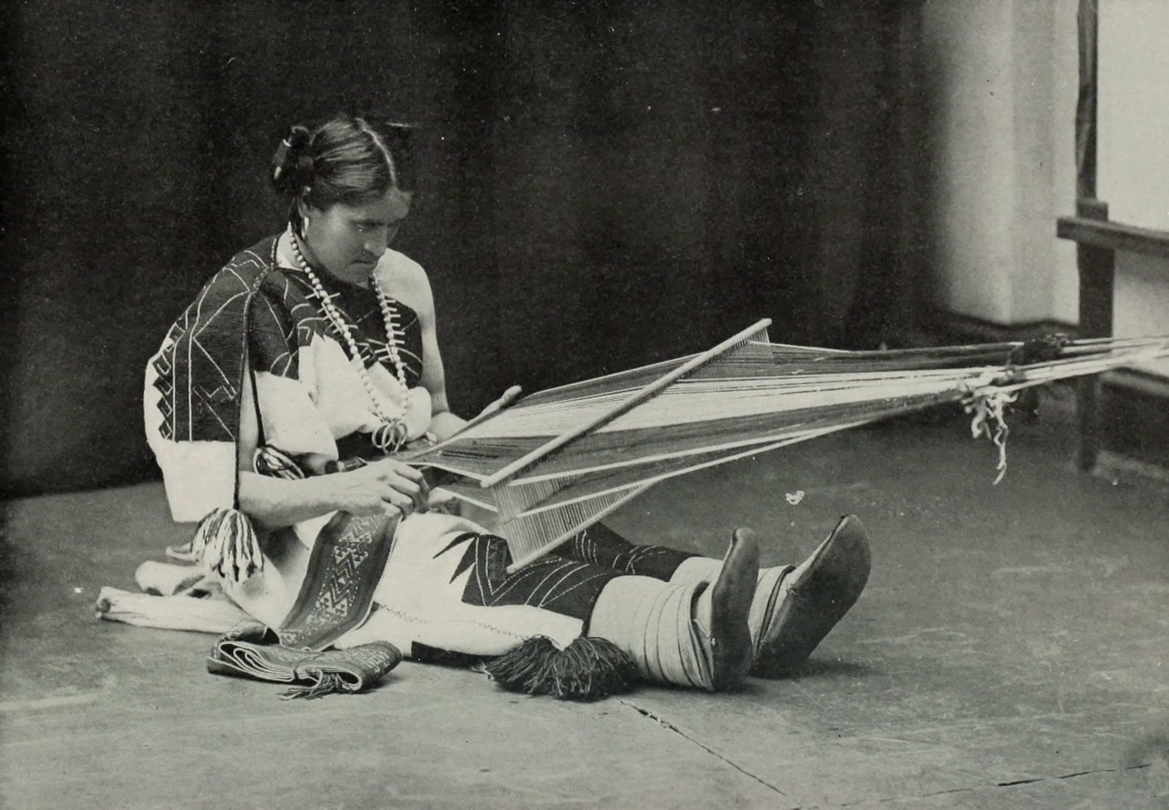 Photo of We’wha sitting on the ground